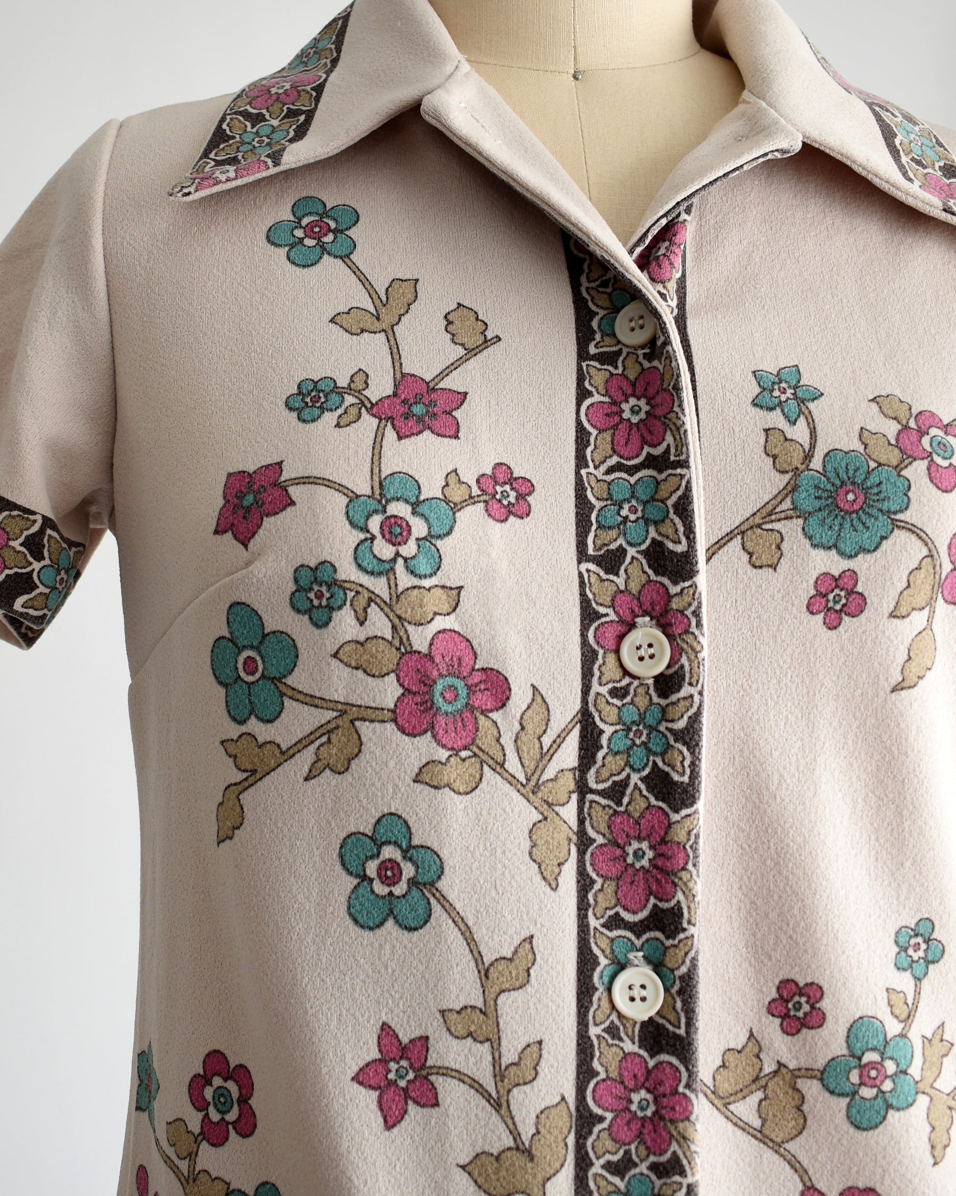 Close up of the floral print and button front