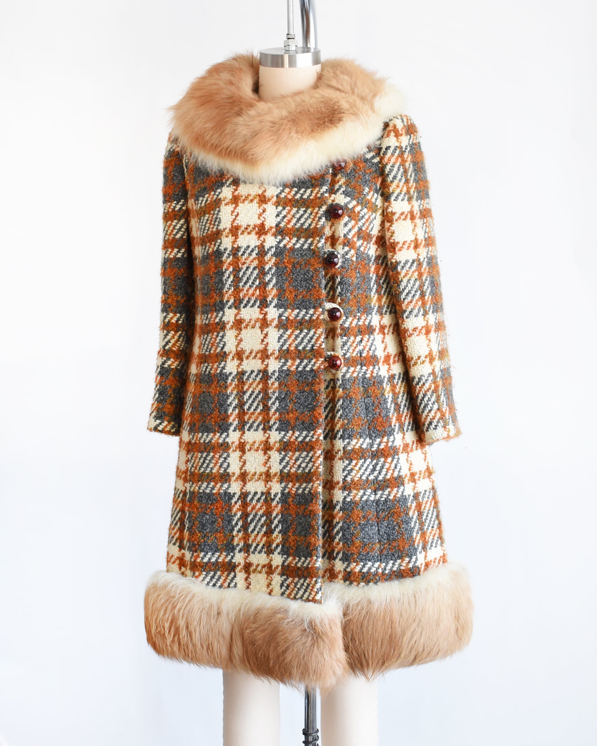 side front view of a vintage 1960s plaid wool coat with guanaco fur trim