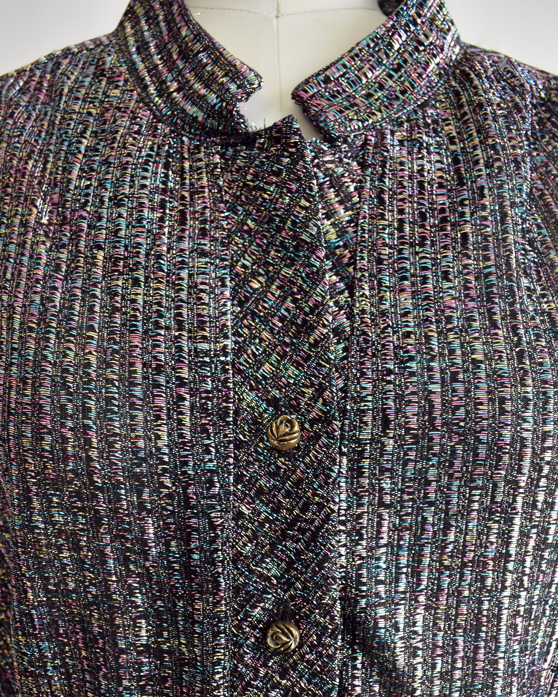 close up of the metallic threads and floral buttons