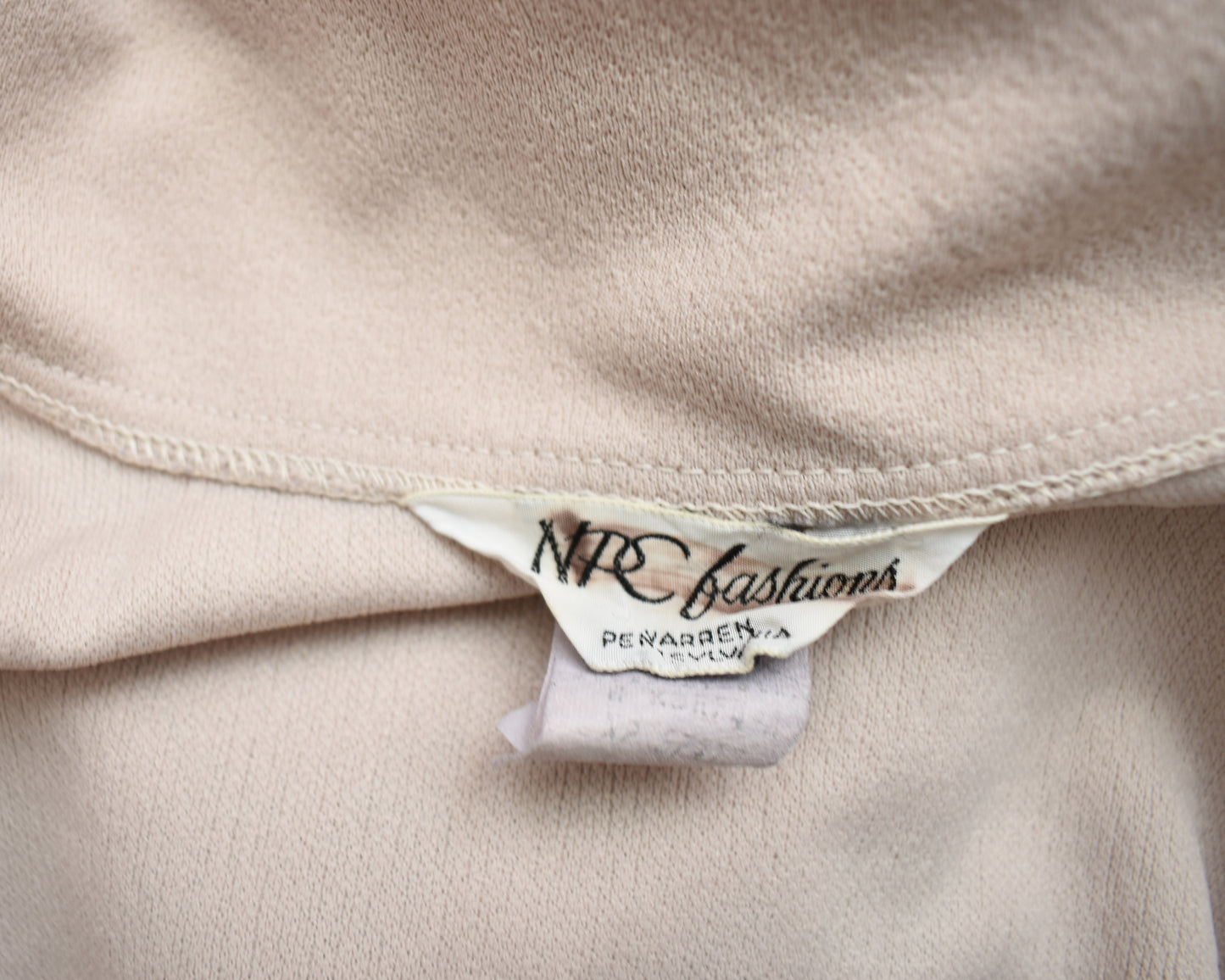 Close up of the tag which says NPC fashions