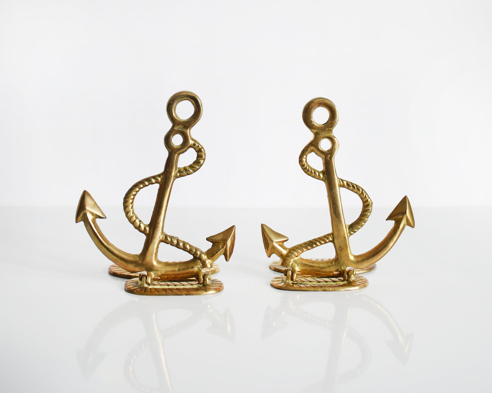 Two vintage brass anchor and rope bookends.