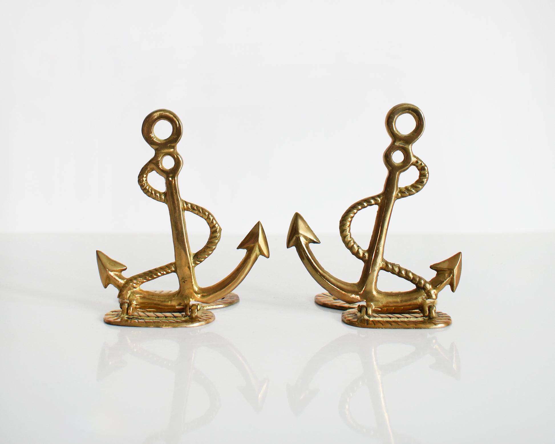 Two vintage brass anchor and rope bookends.