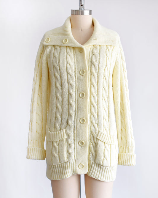 a vintage 1970s cream cable knit cardigan