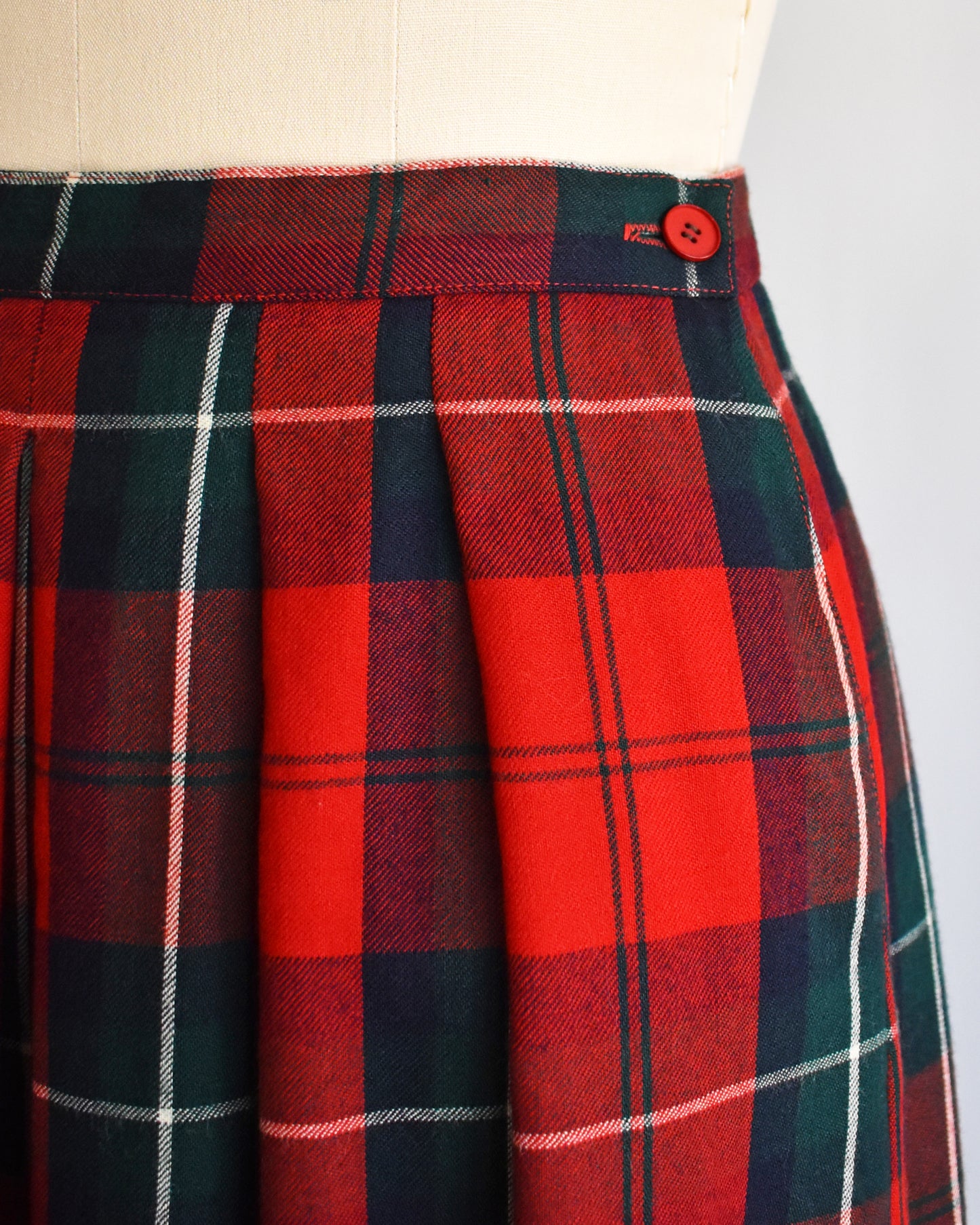 Close up of a the red button on the side of the skirt