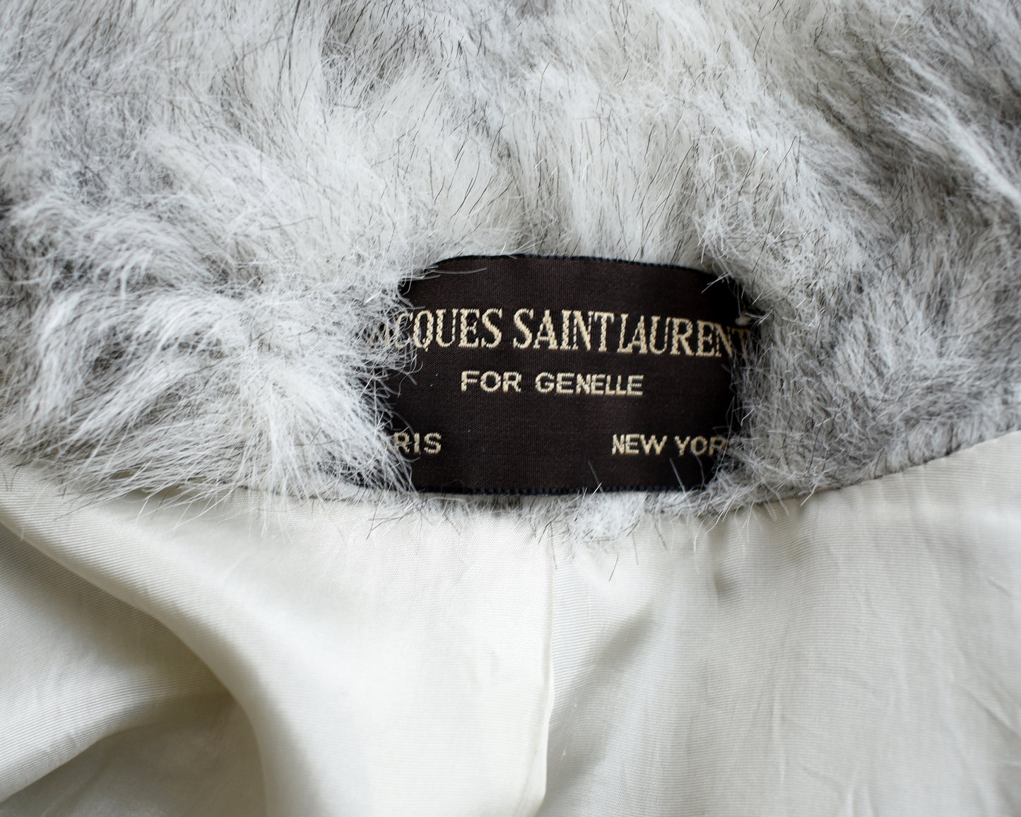 Close up of the tag which says Jaques Saint Laurent 