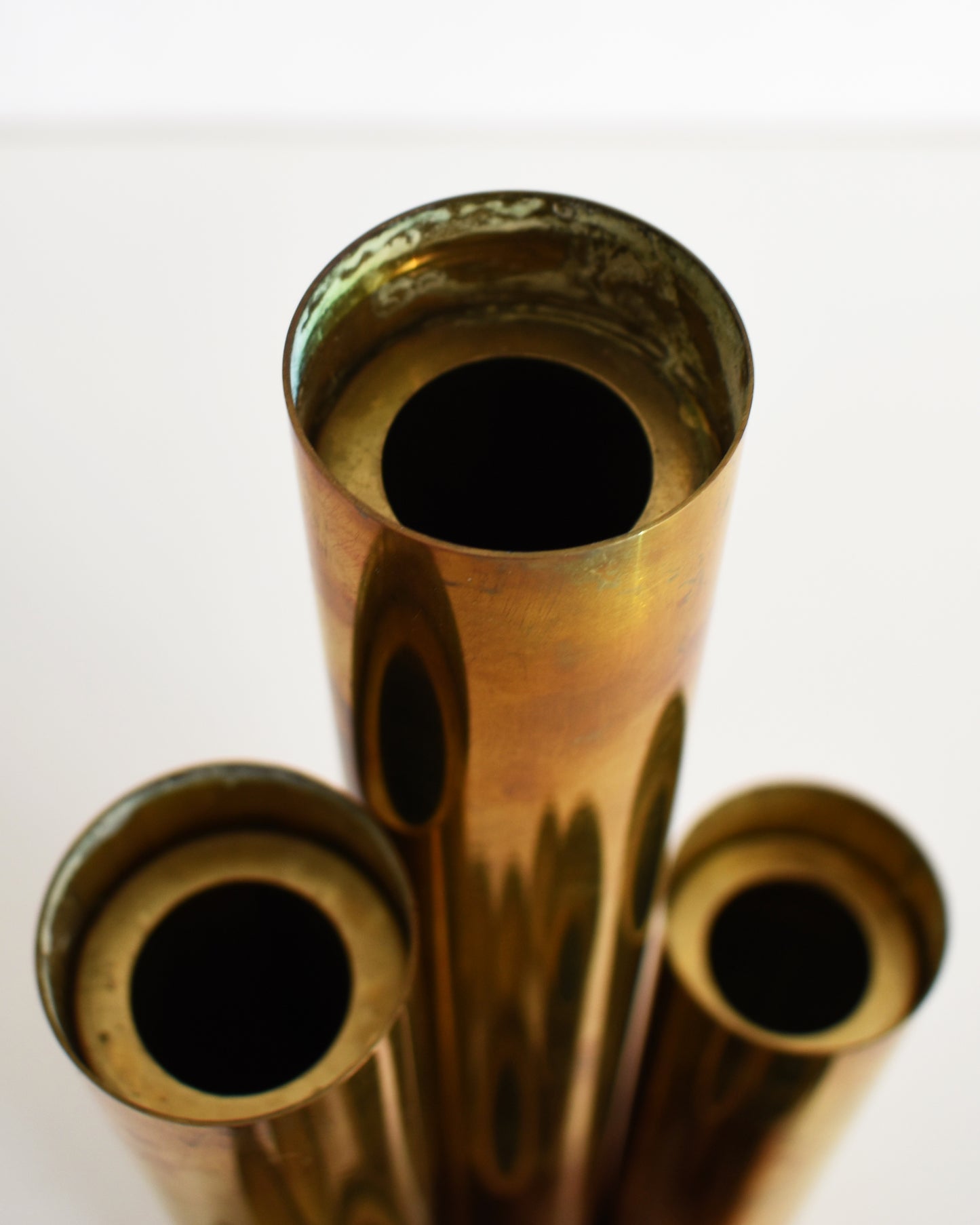 Close up of the tallest candlestick with the insert out, showing the hollow center