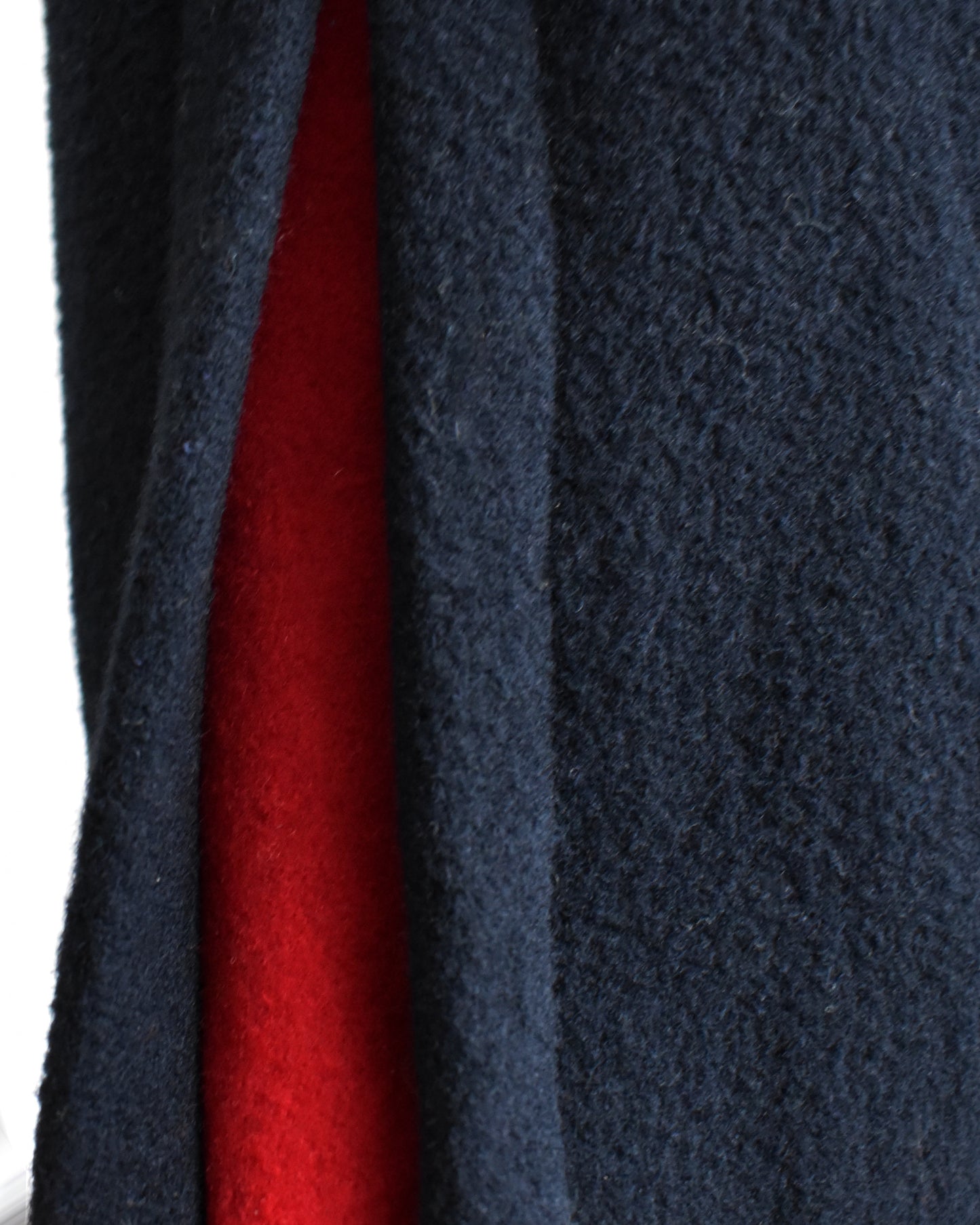 Close-up of the red piping on the cape 
