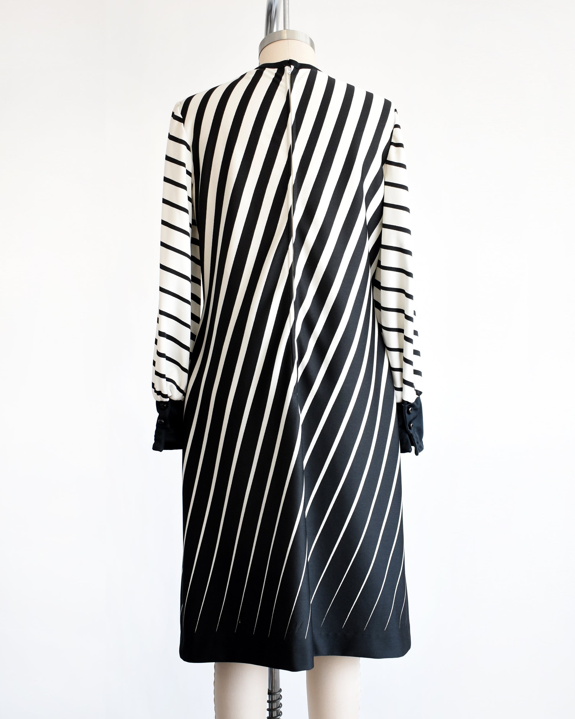 back view of a vintage 1970s black and white diagonal striped dress