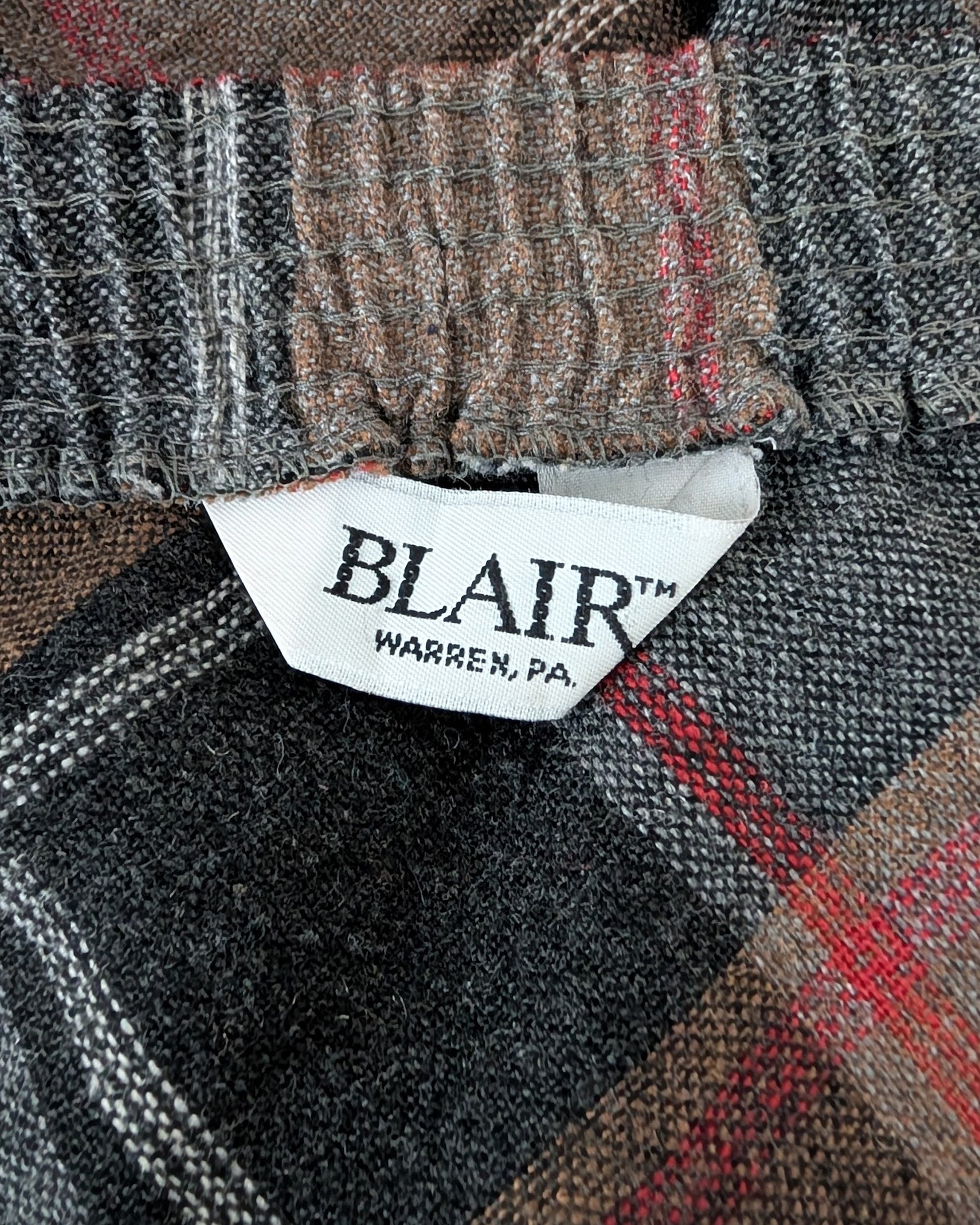 Close-up of a plaid fabric with a Blair label in Warren, PA.