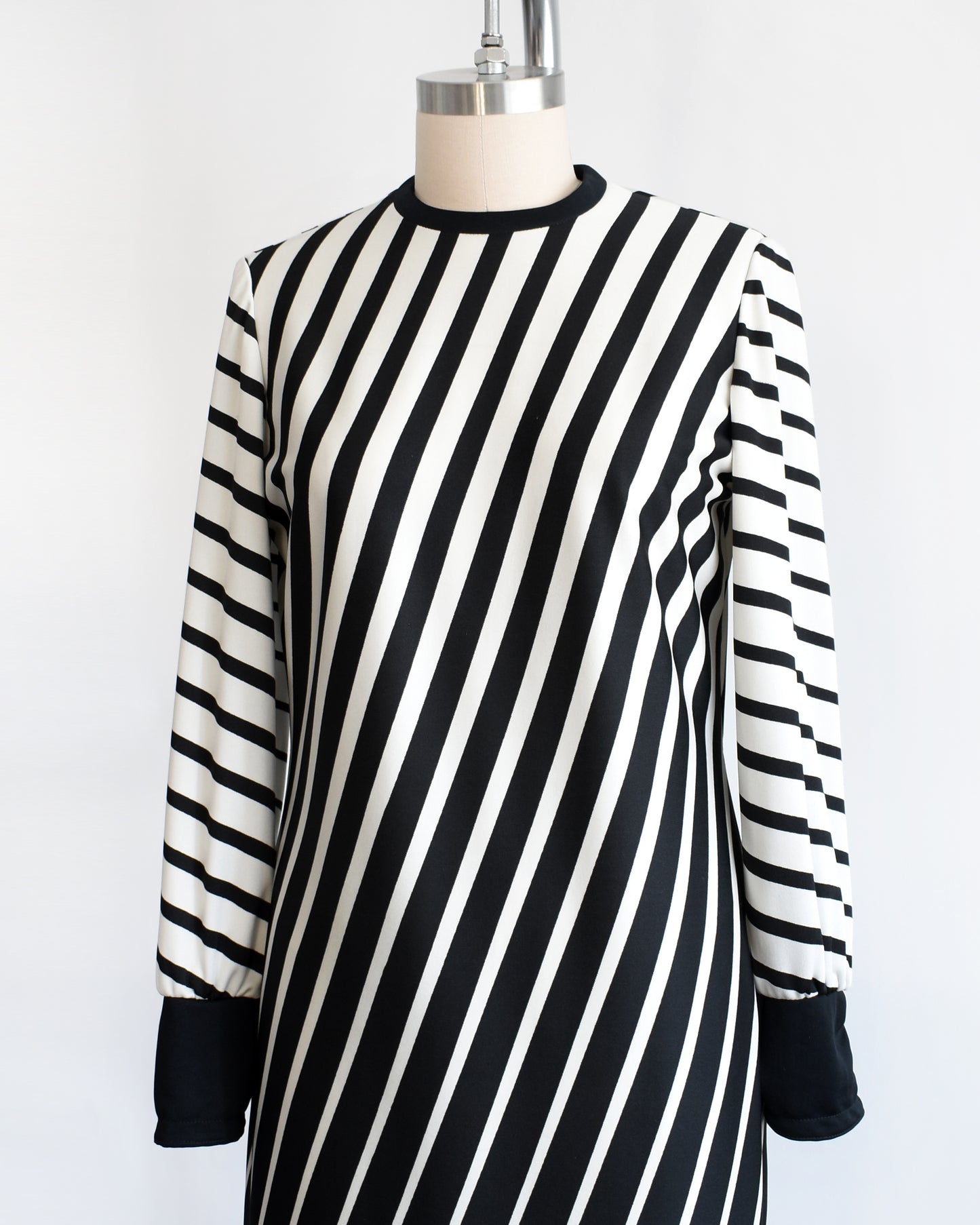 side front view of a vintage 1970s black and white diagonal striped dress