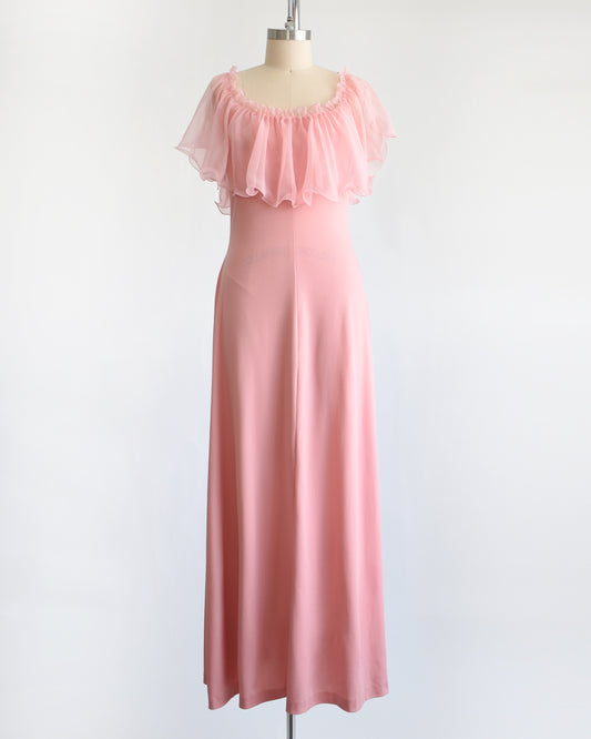 a vintage 1970s pink flutter maxi dress