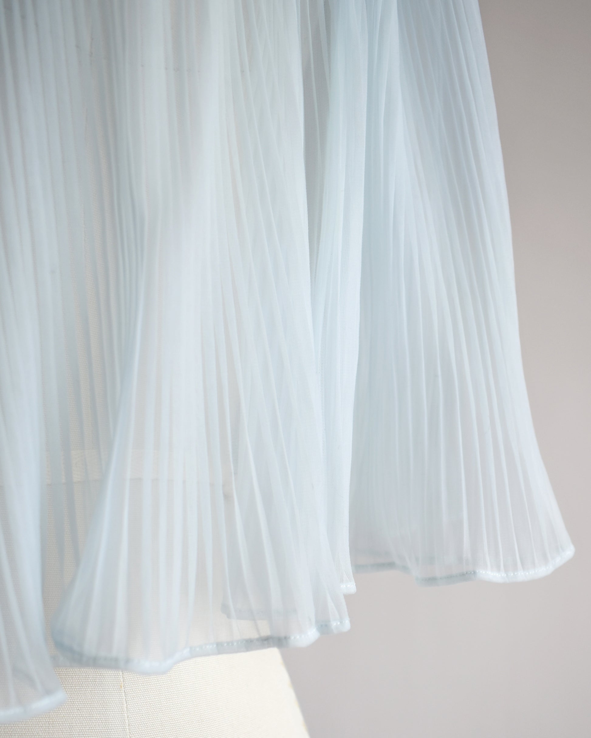 close up of the micropleats on the bed jacket