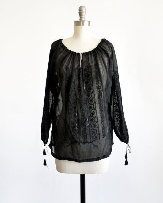 a vintage 1970s black embroidered blouse by Kaiser