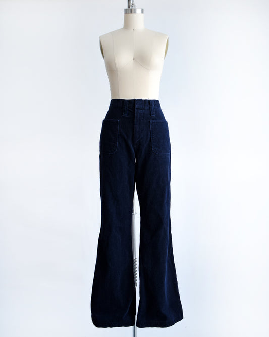 a pair of vintage 1970s navy blue corduroy bell bottoms by Lady Wrangler