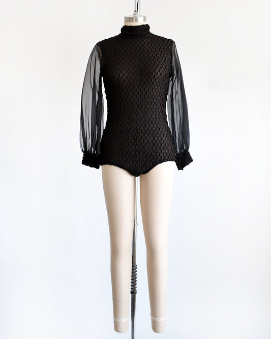 a vintage 1970s black textured bodysuit with long sleeves