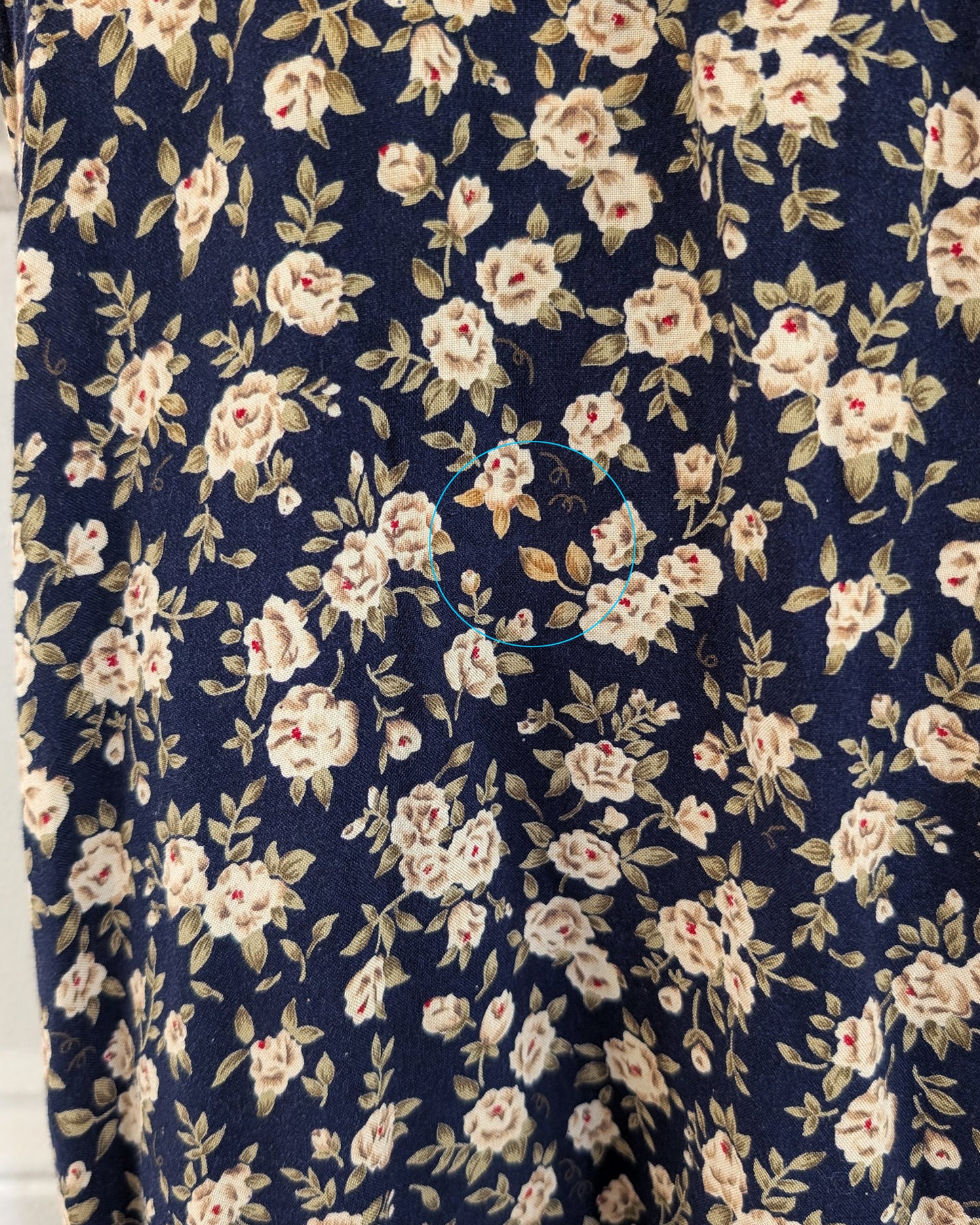 close up of the floral print that is slightly lighter than the rest
