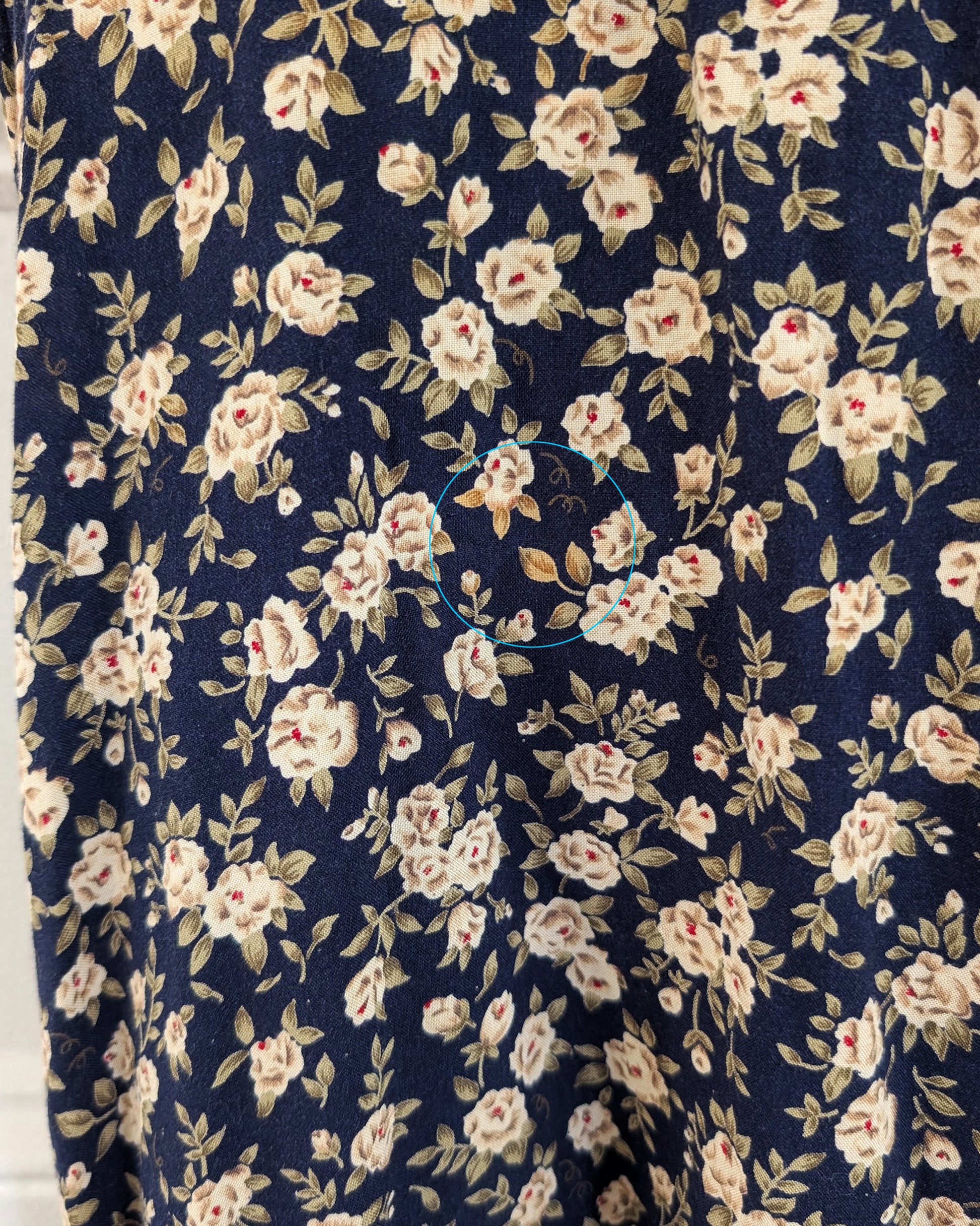 close up of the floral print that is slightly lighter than the rest