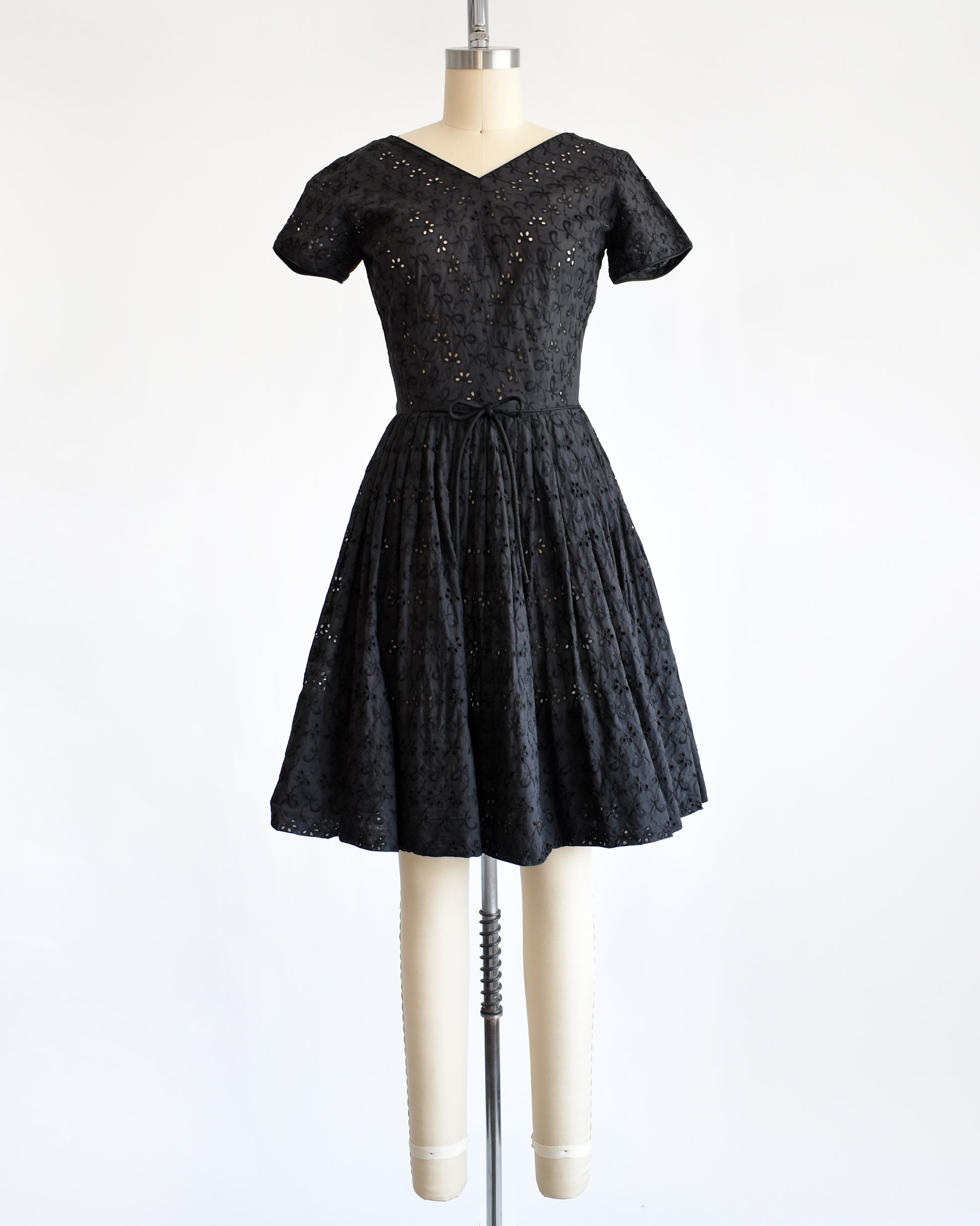 a late 1950s early 1960s vintage black eyelet dress