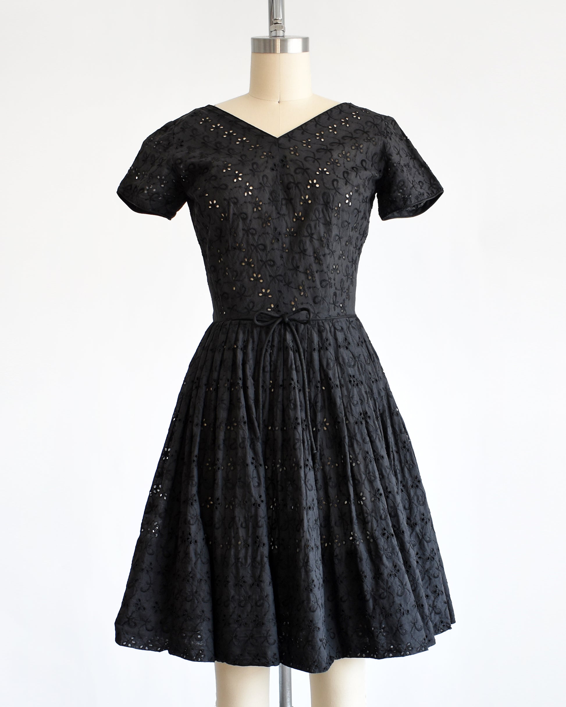 a late 1950s early 1960s vintage black eyelet dress