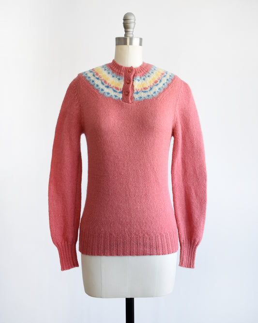 vintage 1980s dark pink sweater with colorful neckline on a mannequin against a white background