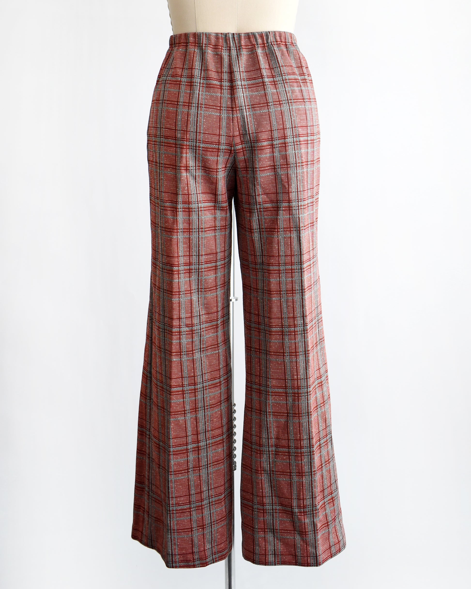 back view of vintage 1970s red plaid pants on a mannequin against a white background