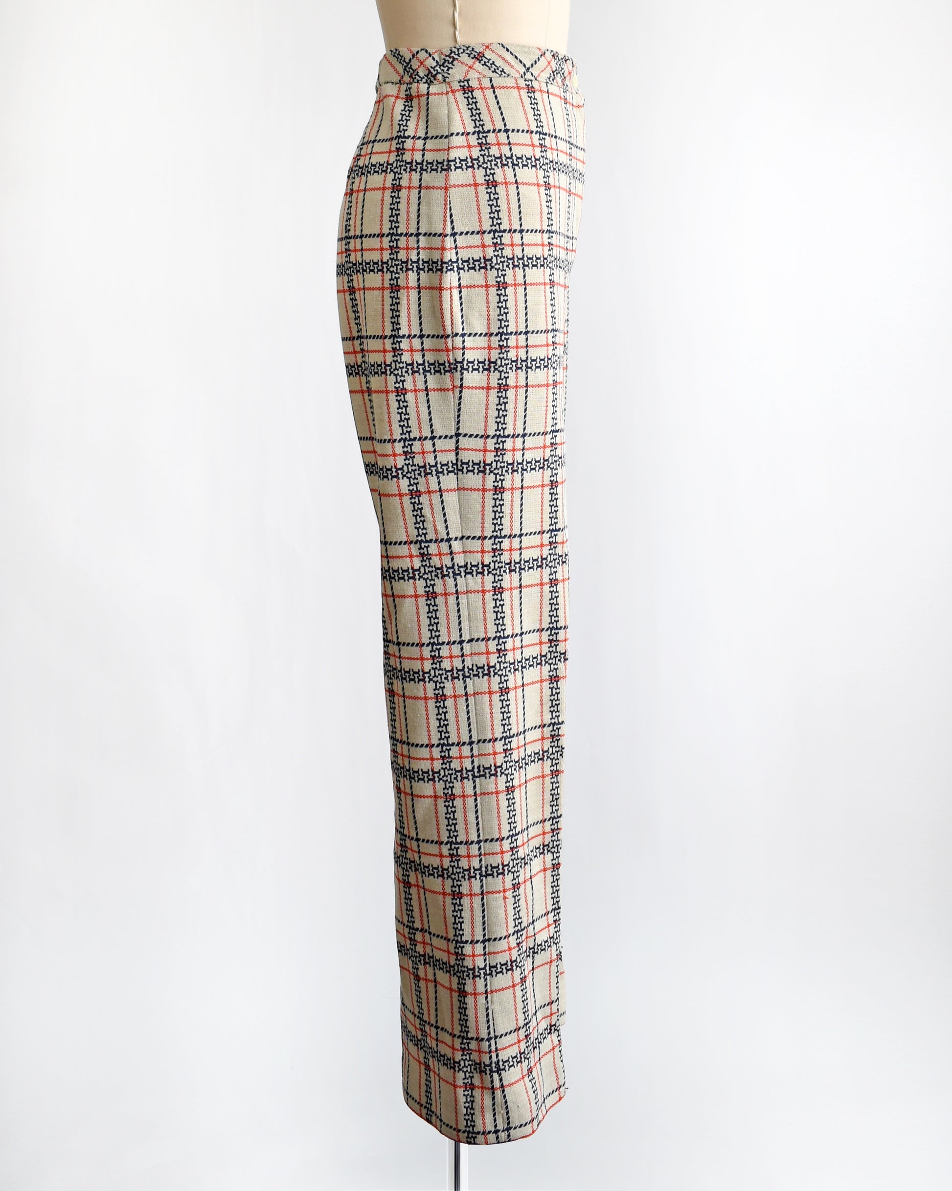 side view of vintage 1970s plaid pants on a mannequin against a white background