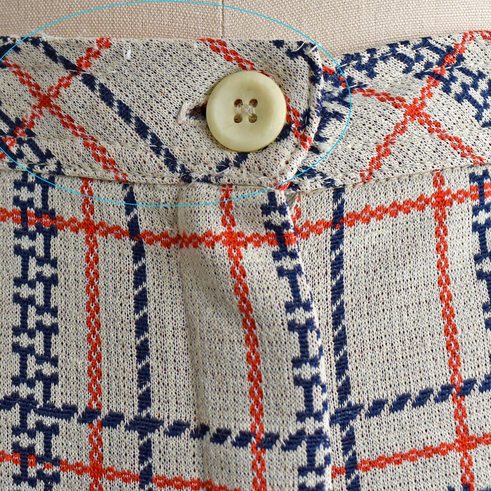 close up of the waist which has a small seam break flaw