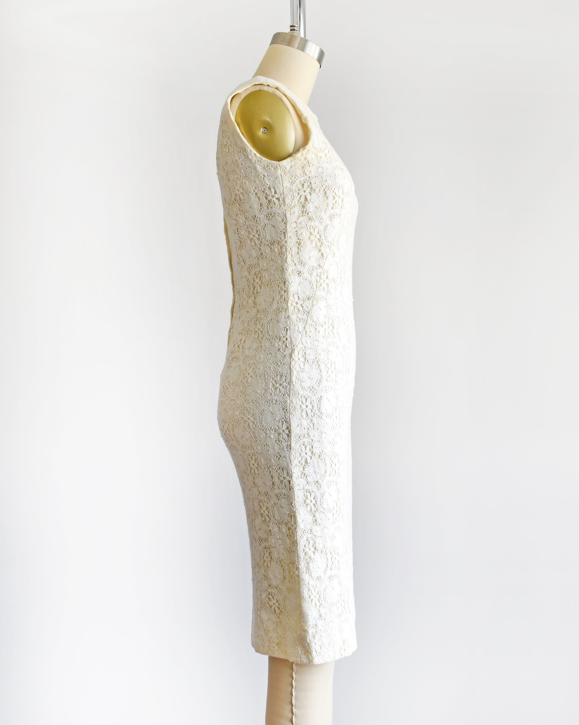 side view of a vintage 1960s floral cream lace dress