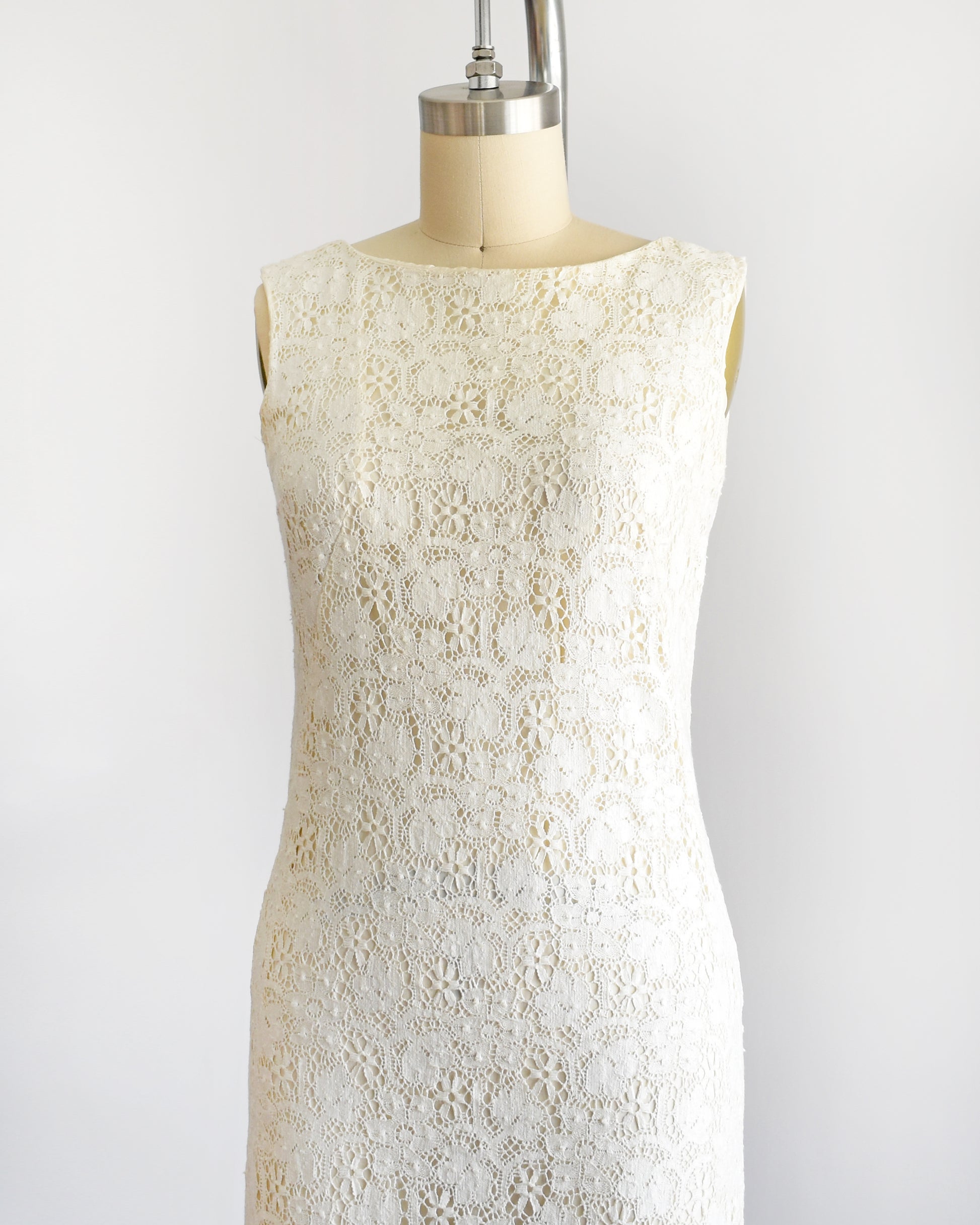 side front view of a vintage 1960s floral cream lace dress