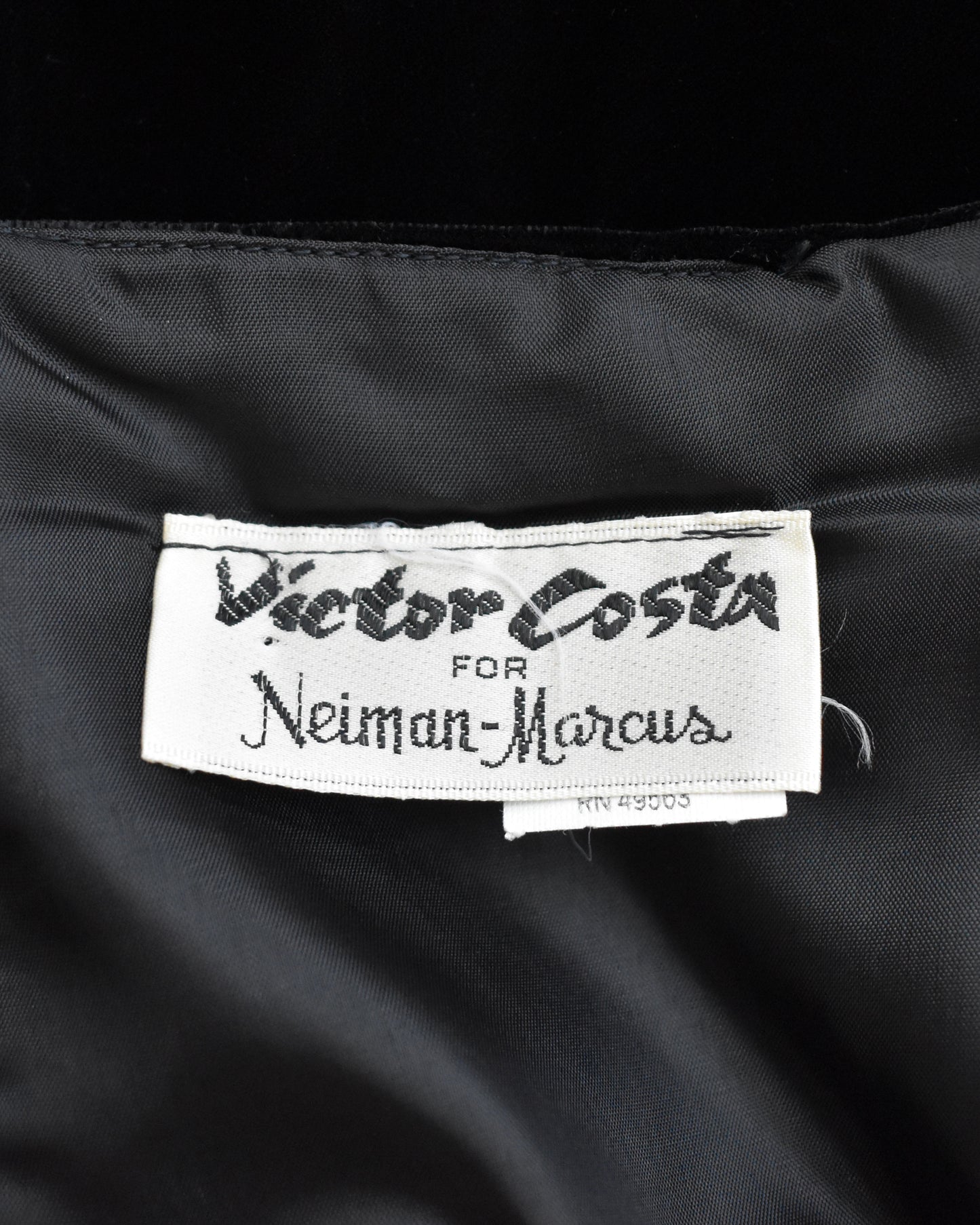 Label on a black garment with 'Victor Costa for Neiman Marcus' text