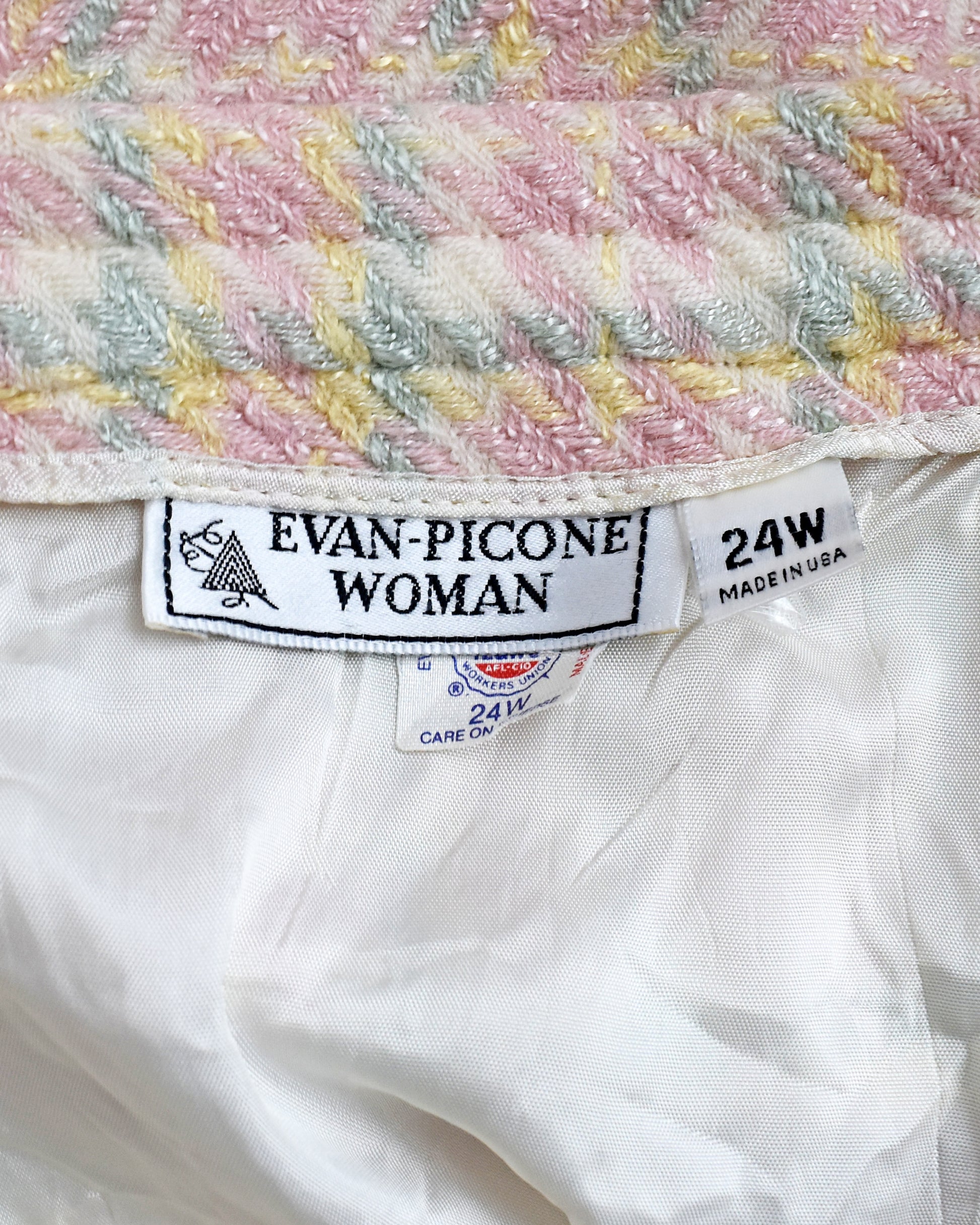 Close-up of a label on a garment with 'Evan-Picone Woman' branding.
