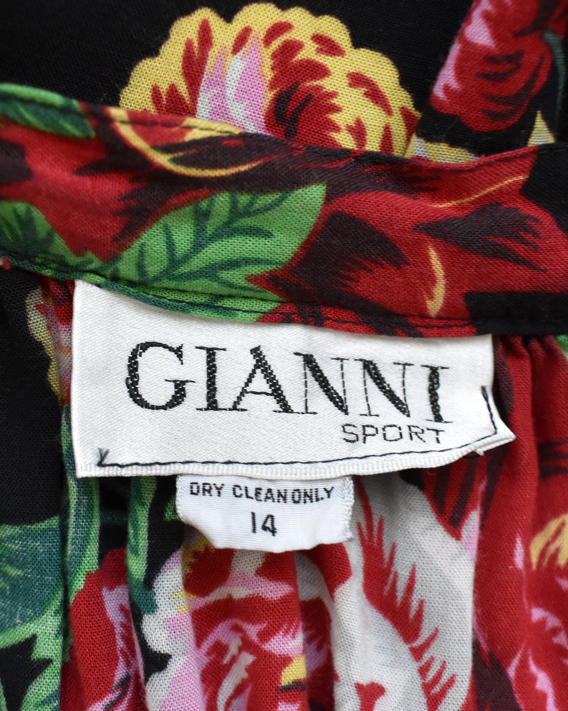 Close-up of a colorful fabric with a 'Gianni Sport' label.