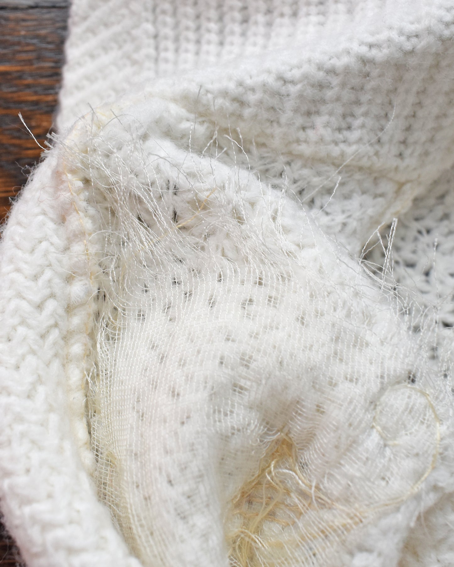 close up of the applique netting on the inside of the sweater