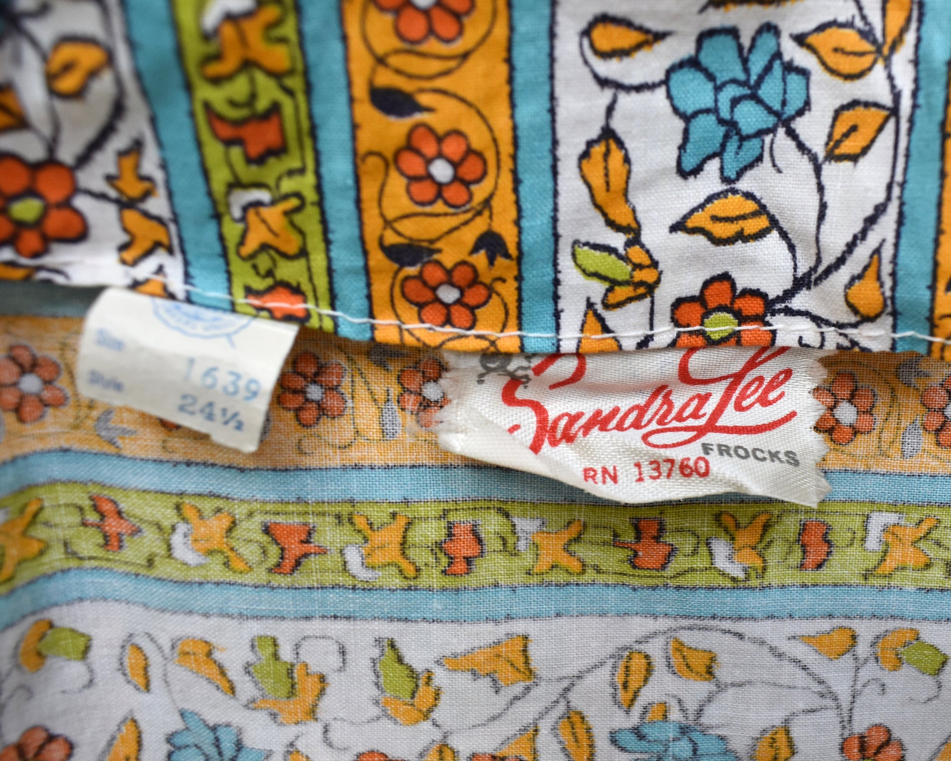 close up of the tag which says Sandra Lee Frocks