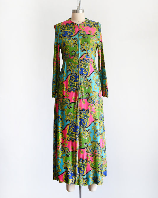 a vintage late 1960s early 1970s psychedelic paisley print maxi dress