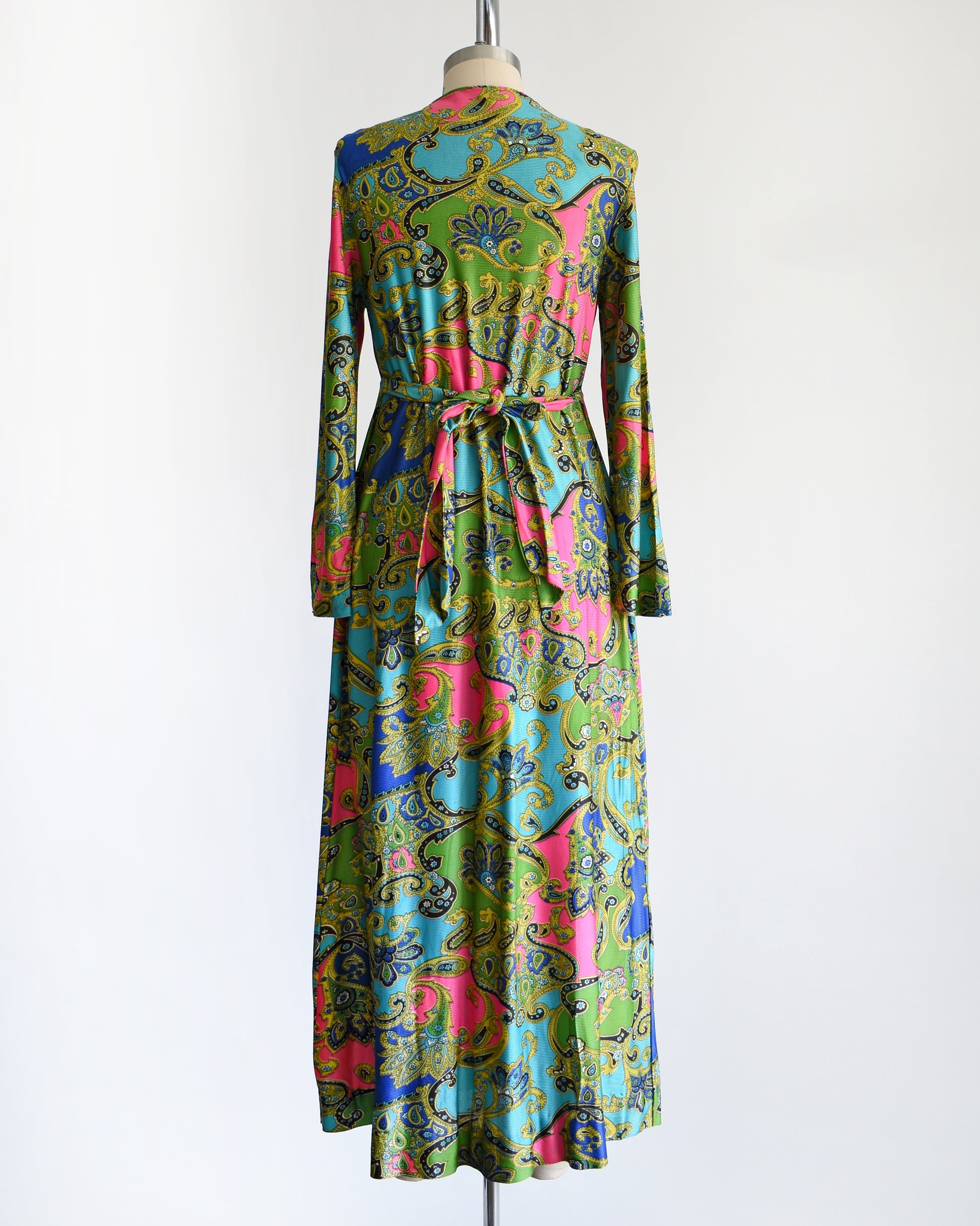 back view of a vintage late 1960s early 1970s psychedelic paisley print maxi dress