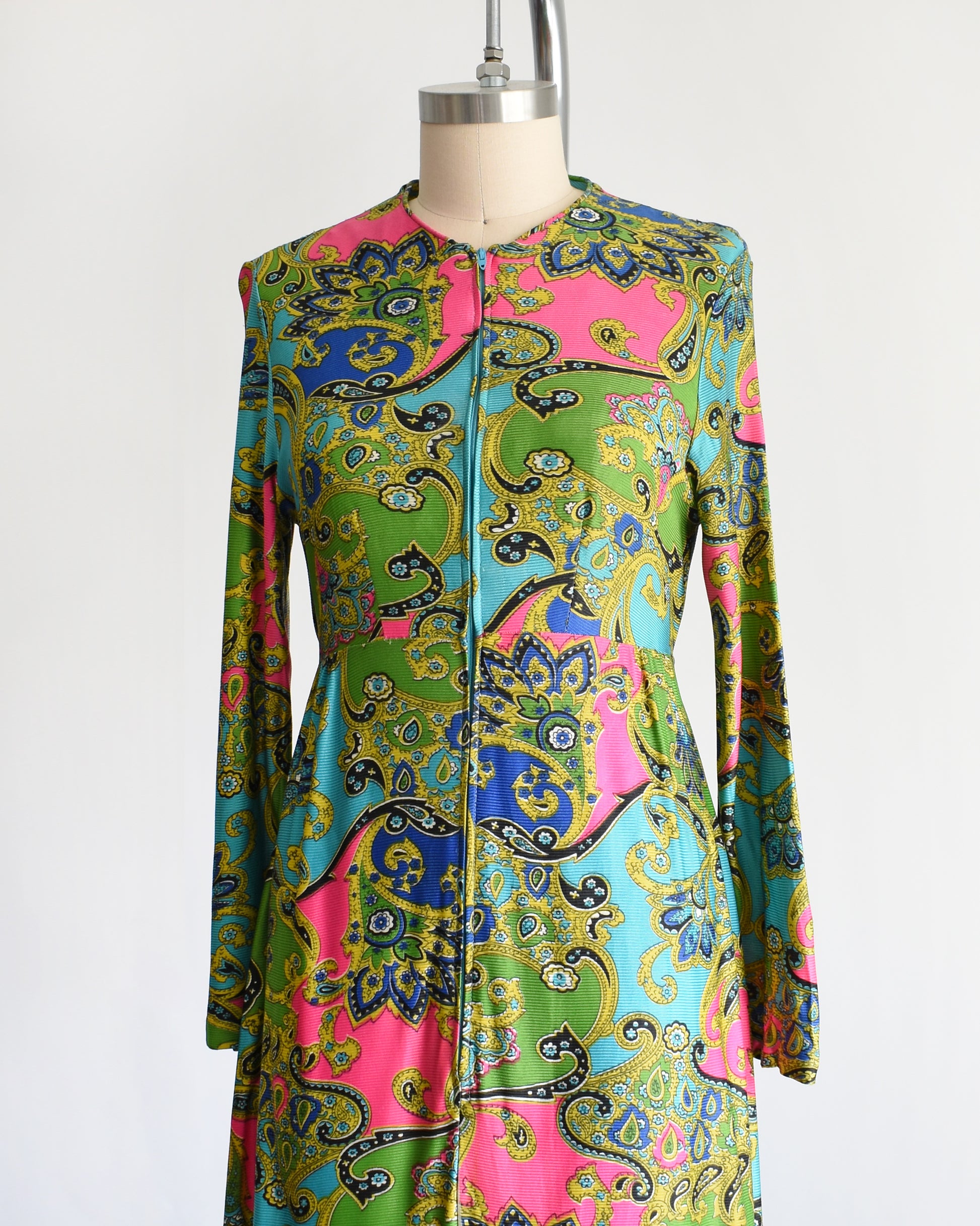 side front view of a vintage late 1960s early 1970s psychedelic paisley print maxi dress