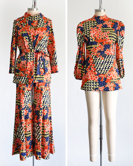 side by side front view of vintage 1970 4 piece floral pantsuit. The left side shows the coat, the sleeveless top, and pants. The right shows the long sleeve tunic.