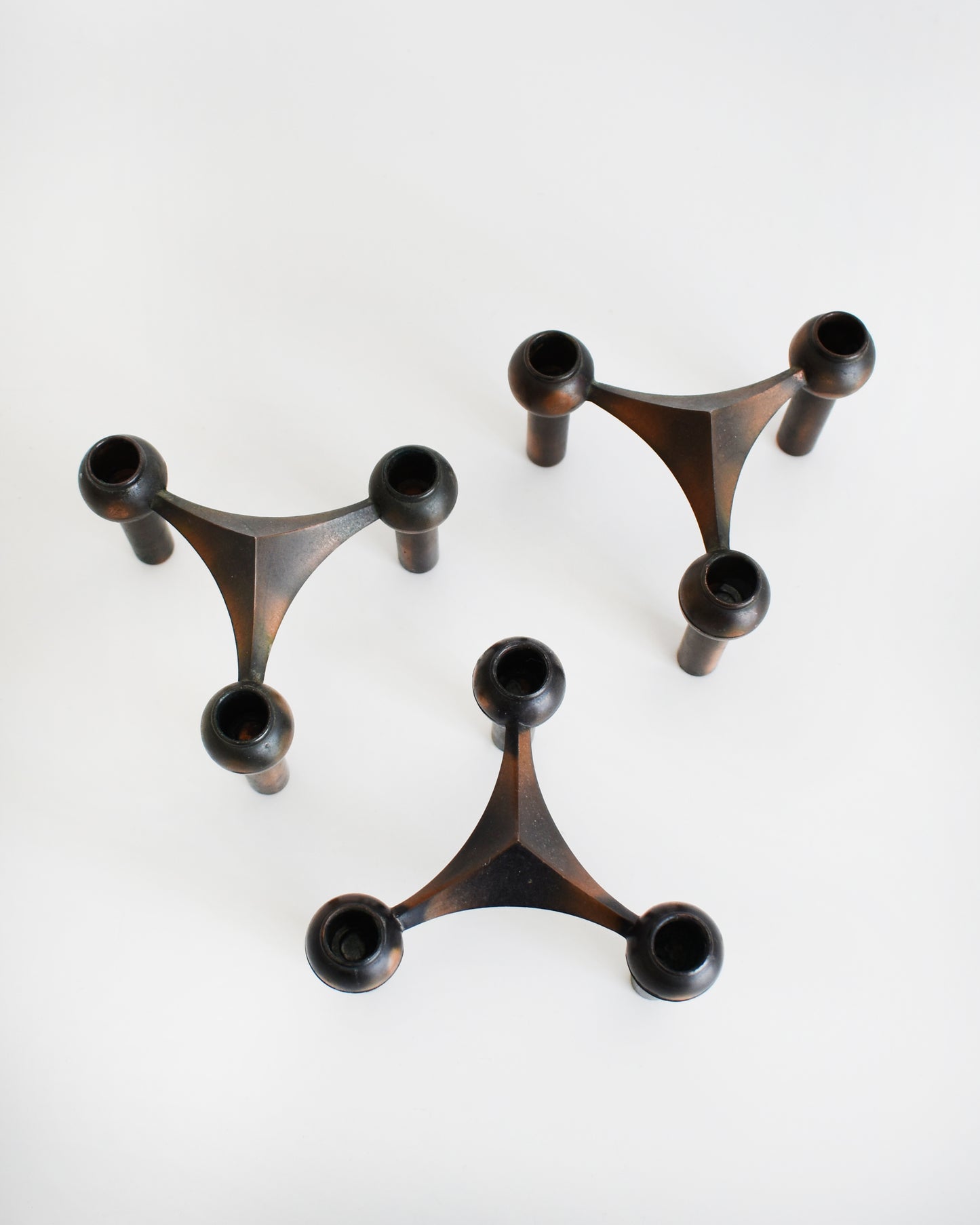 overhead shot of a set of three vintage late 1960s early 1970s modular candle holders