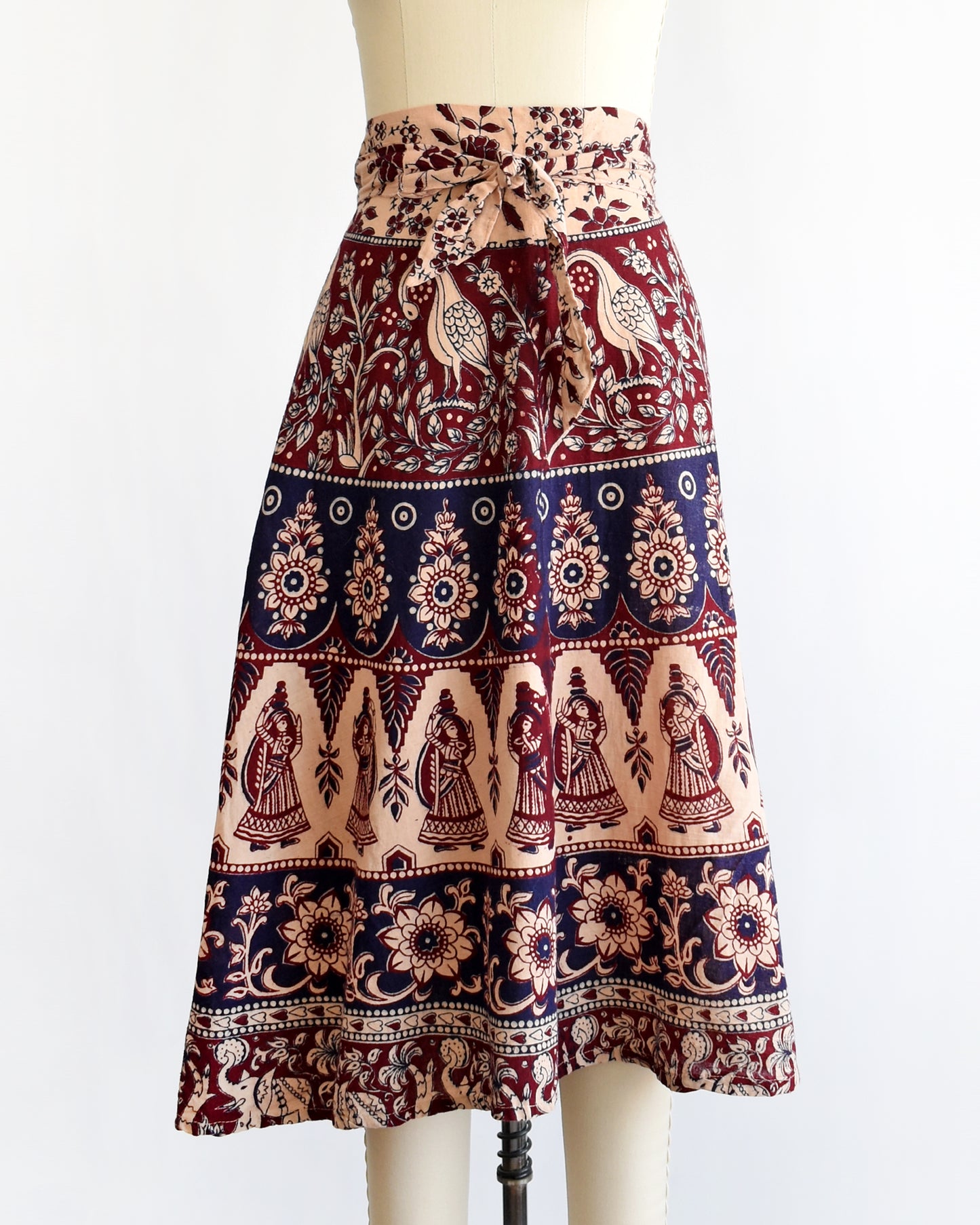 a vintage 1970s block print skirt on a mannequin against a white background