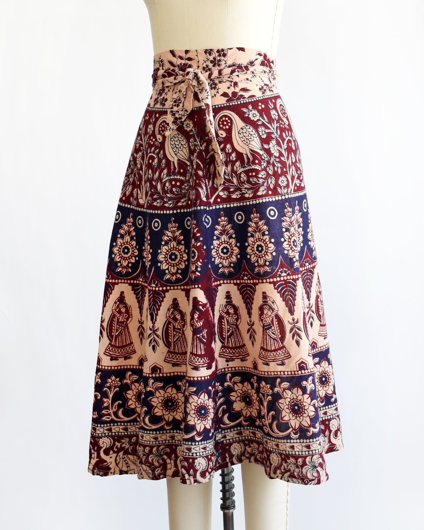 side front view of a vintage 1970s block print skirt on a mannequin against a white background