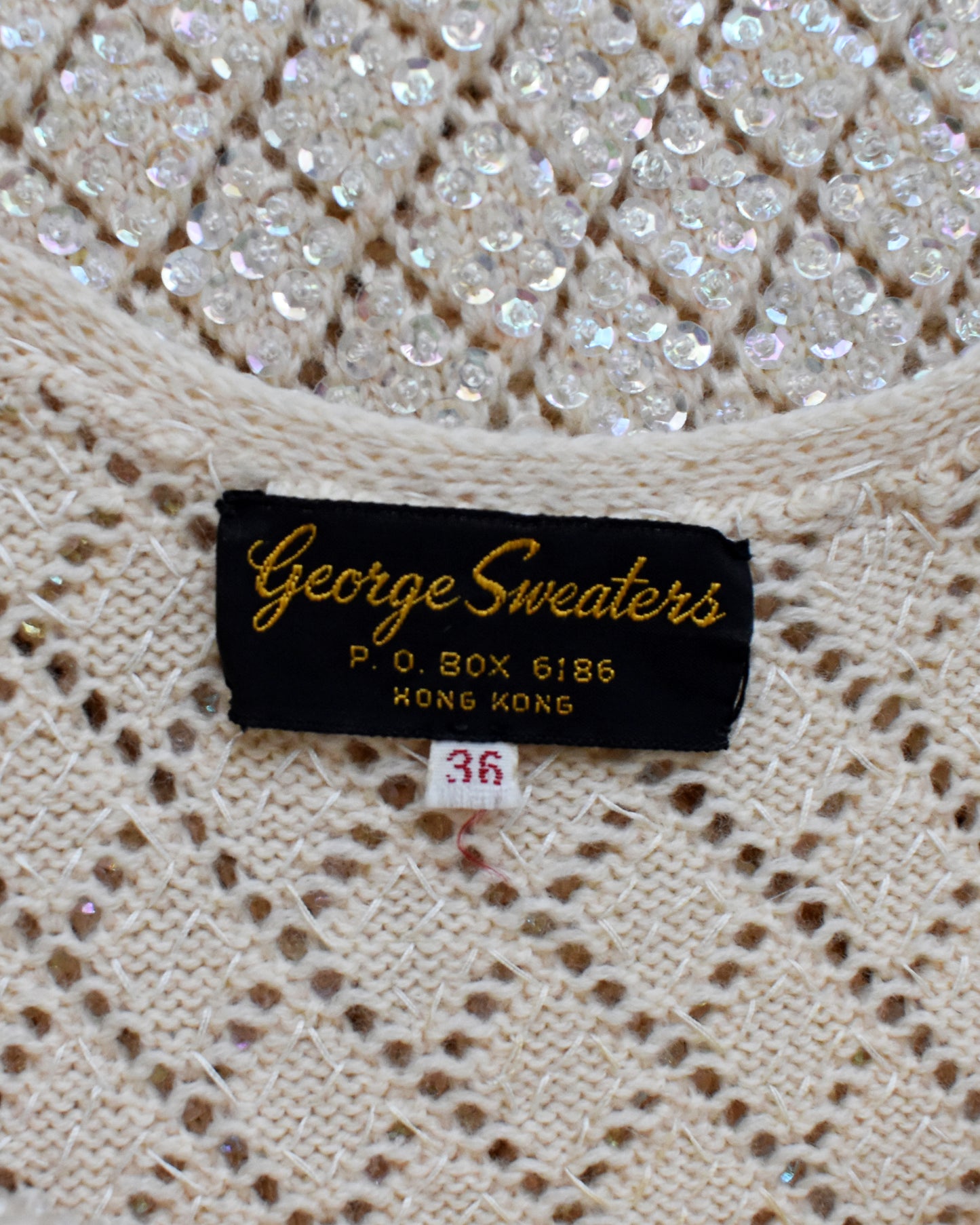 close up of the 'George Sweaters' label