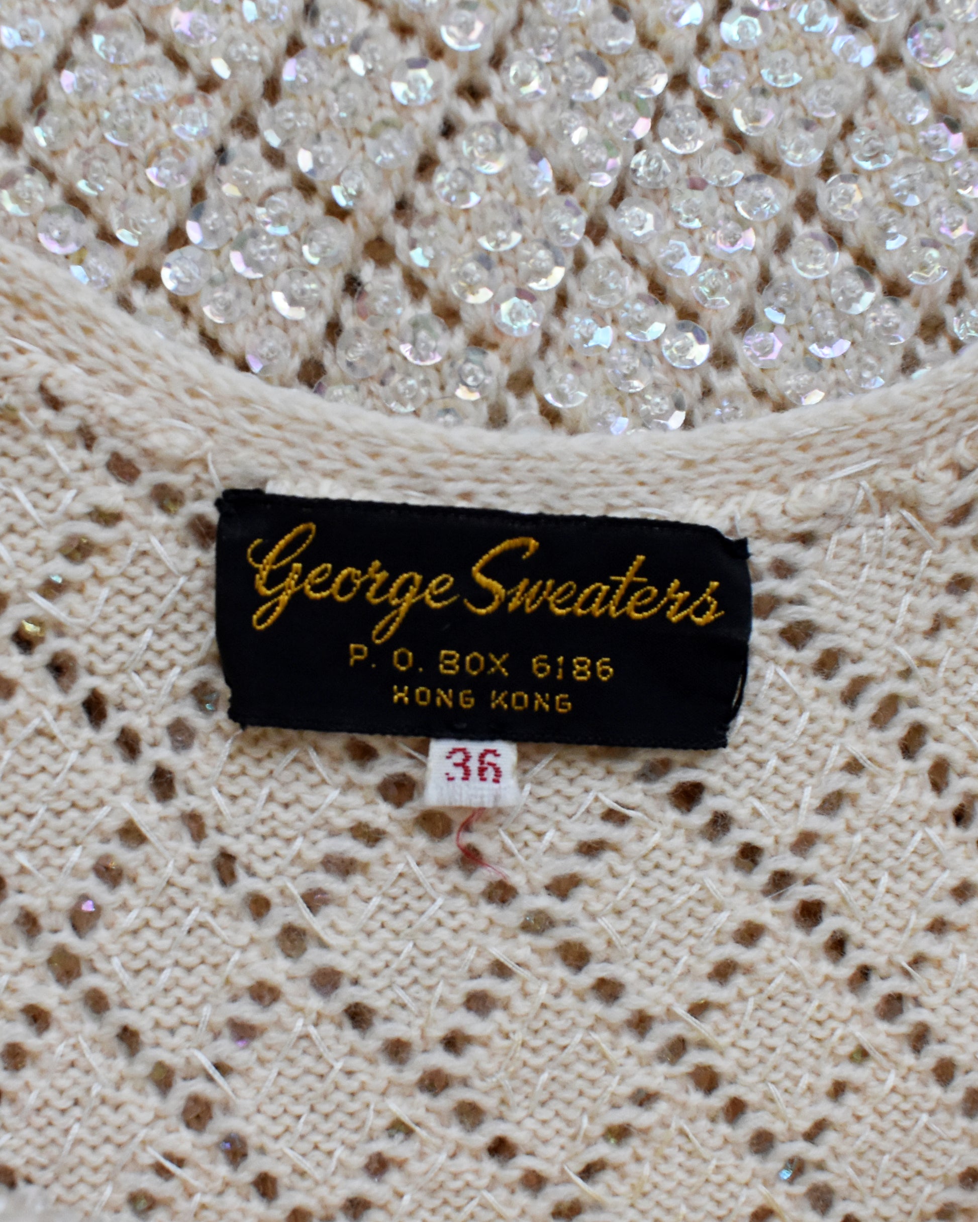 close up of the 'George Sweaters' label