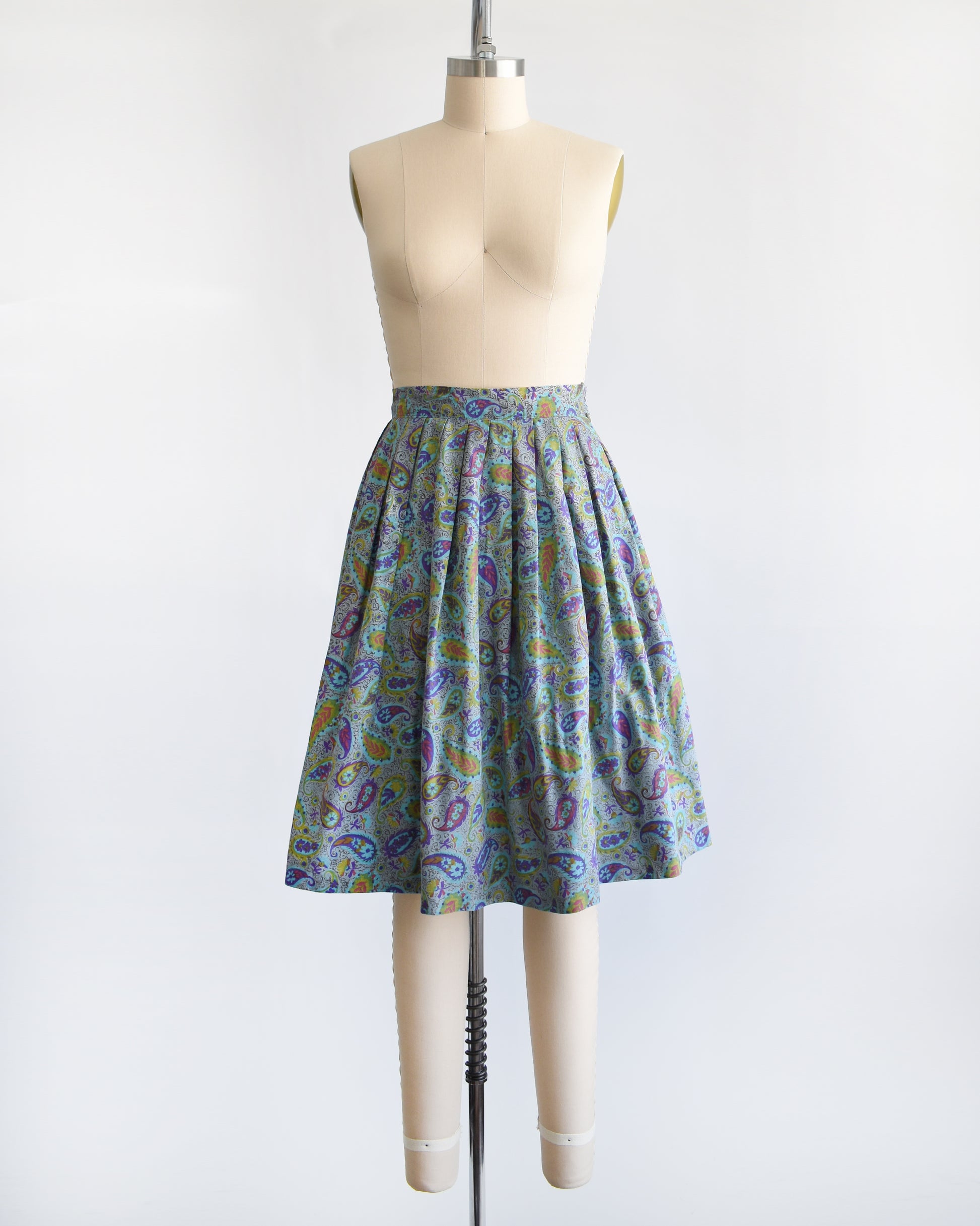 a vintage 1950s floral paisley skirt on a mannequin against a white background