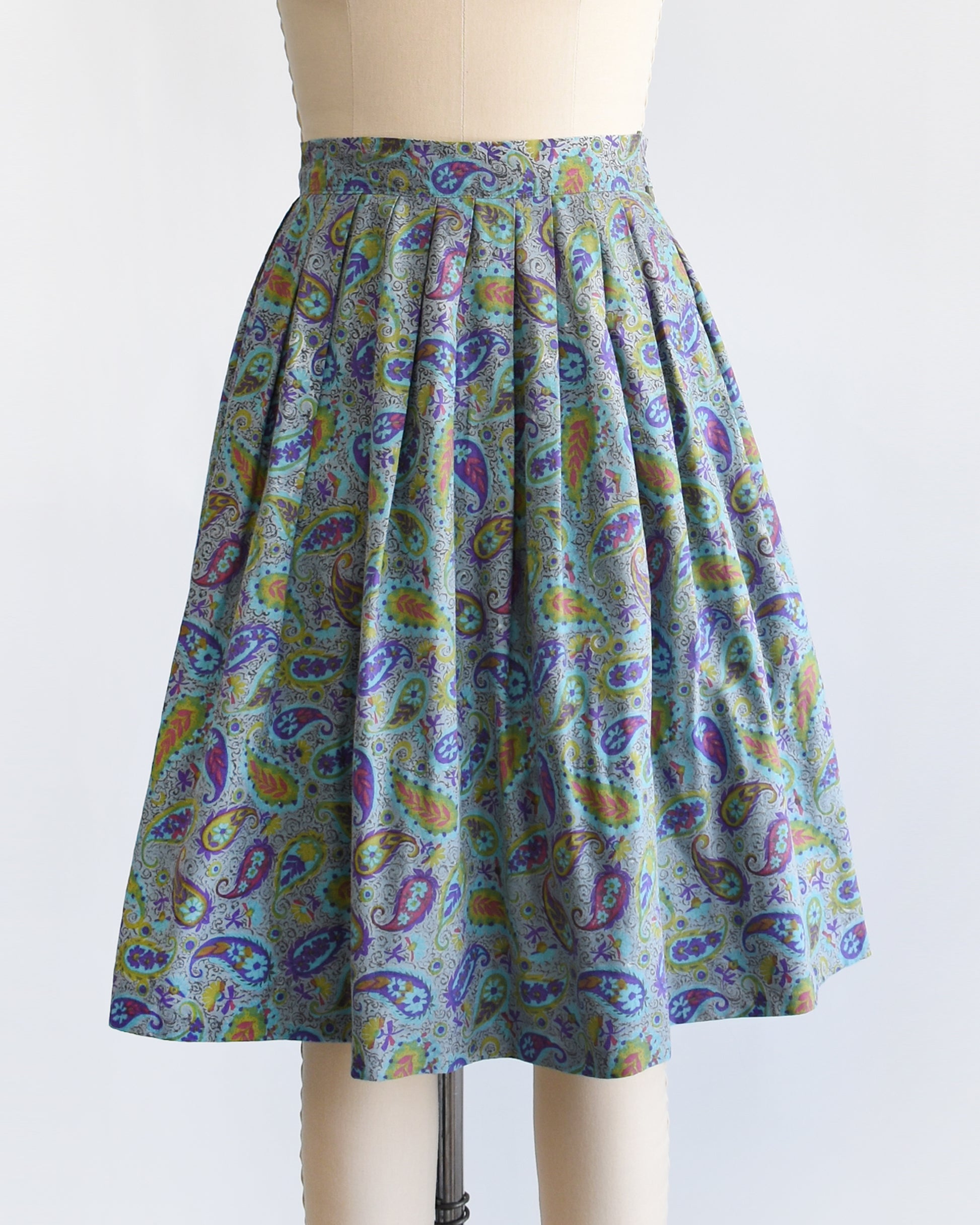 a vintage 1950s floral paisley skirt on a mannequin against a white background