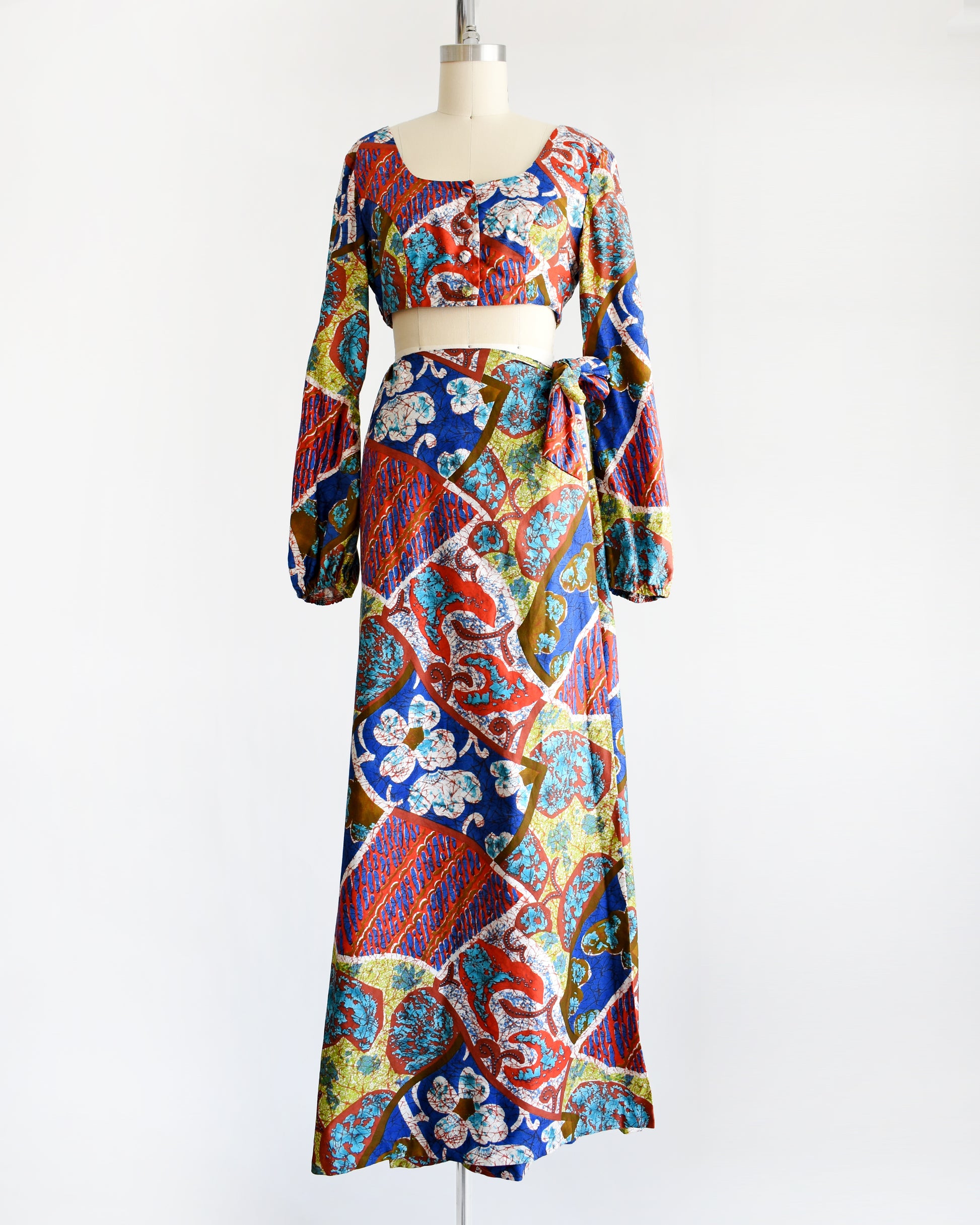 a vintage 1960s/1970s Hawaiian two piece crop top and maxi skirt set by Kahala. 