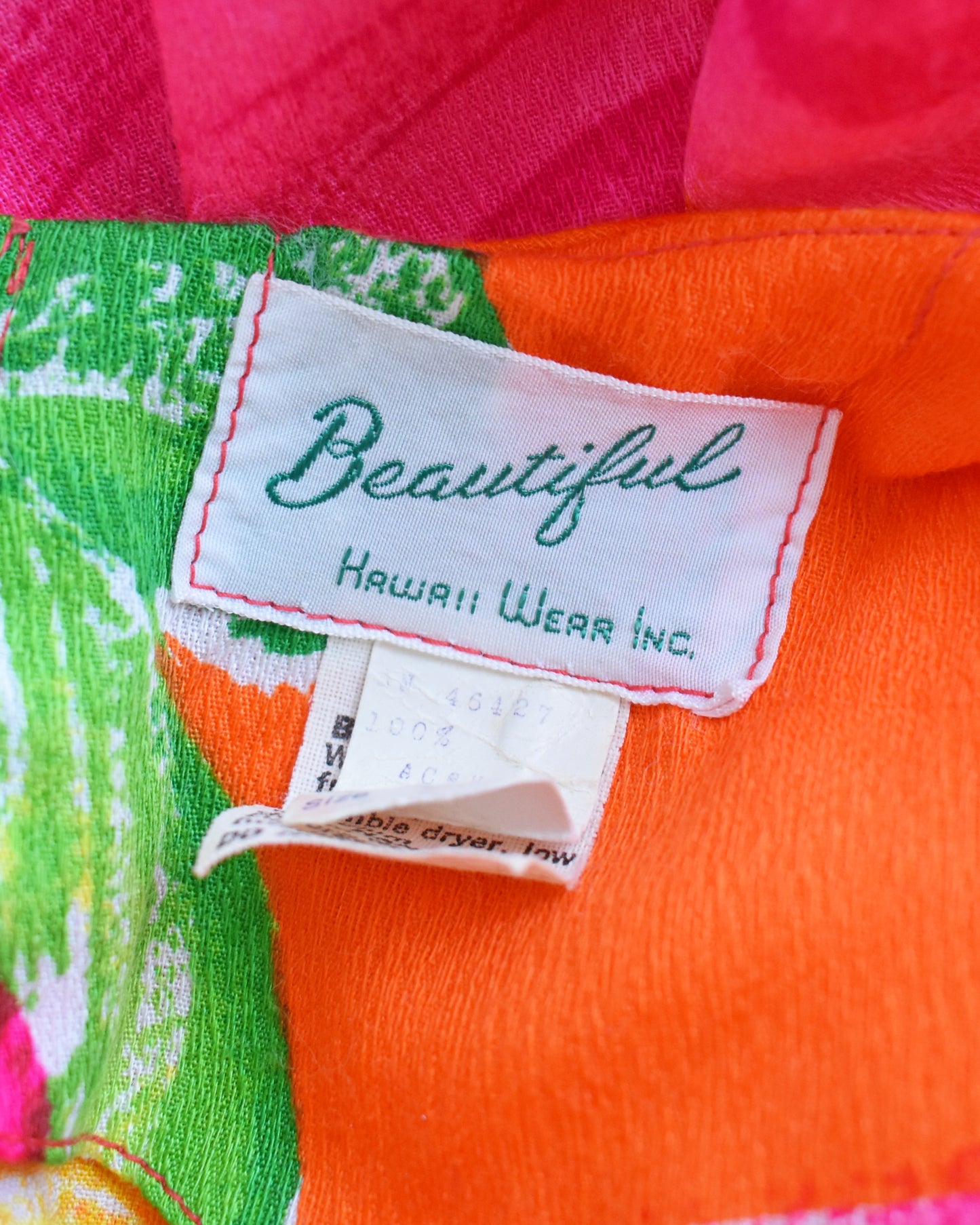 close up of the tag which says Beautiful Hawaii Wear Inc