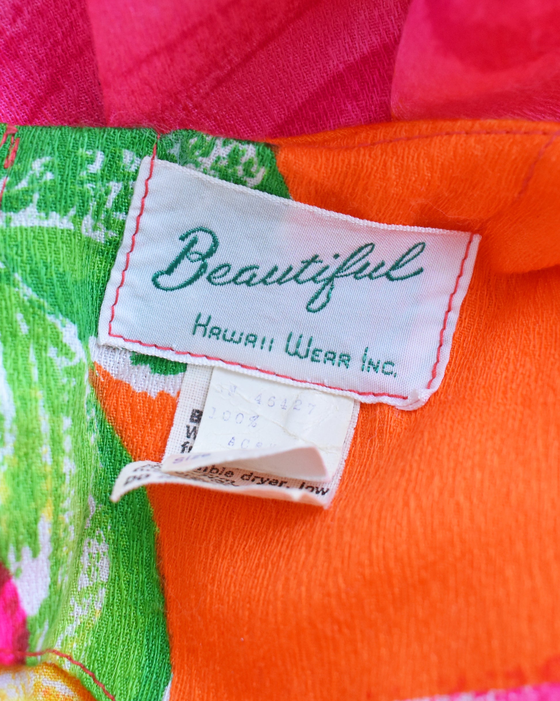 close up of the tag which says Beautiful Hawaii Wear Inc