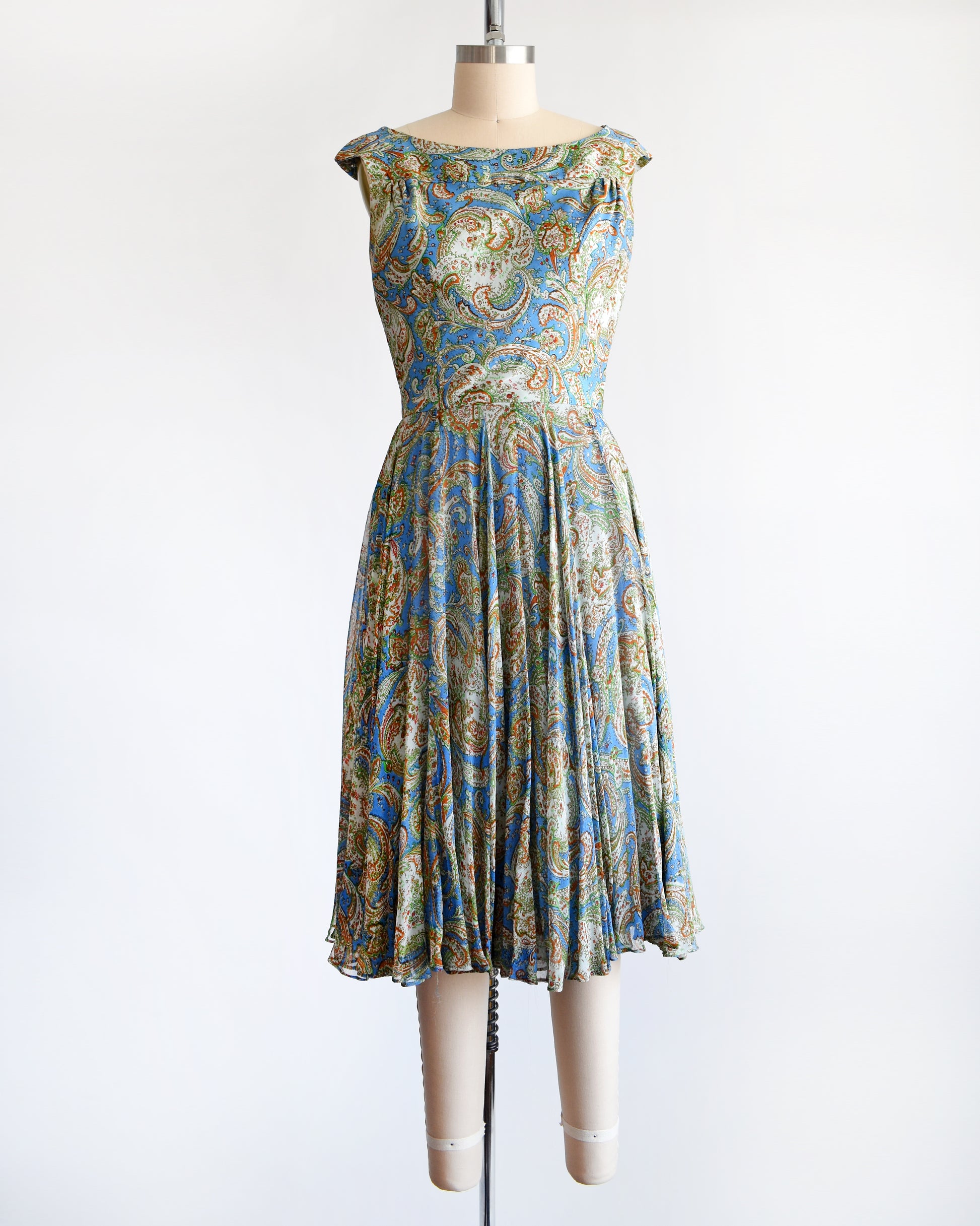 a vintage 1950s silk paisley dress set by Saks Fifth Avenue. the jacket is off in this photo