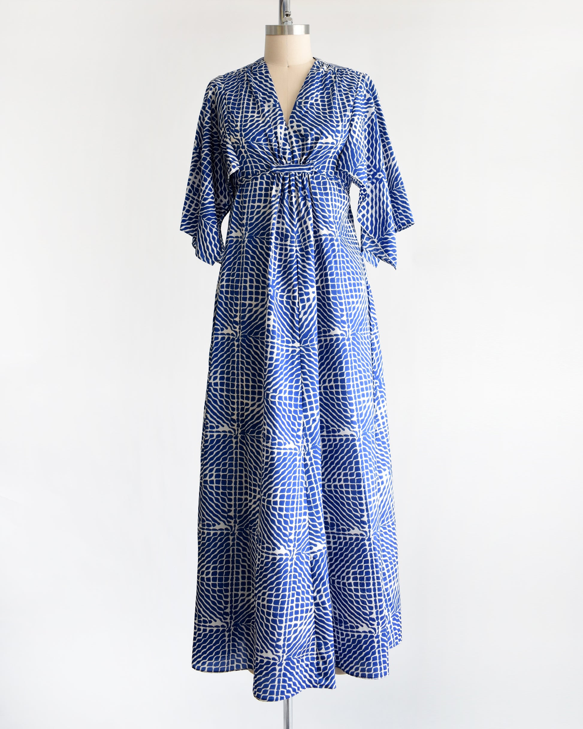 a vintage 1970s blue and white caftan with handkerchief sleeves